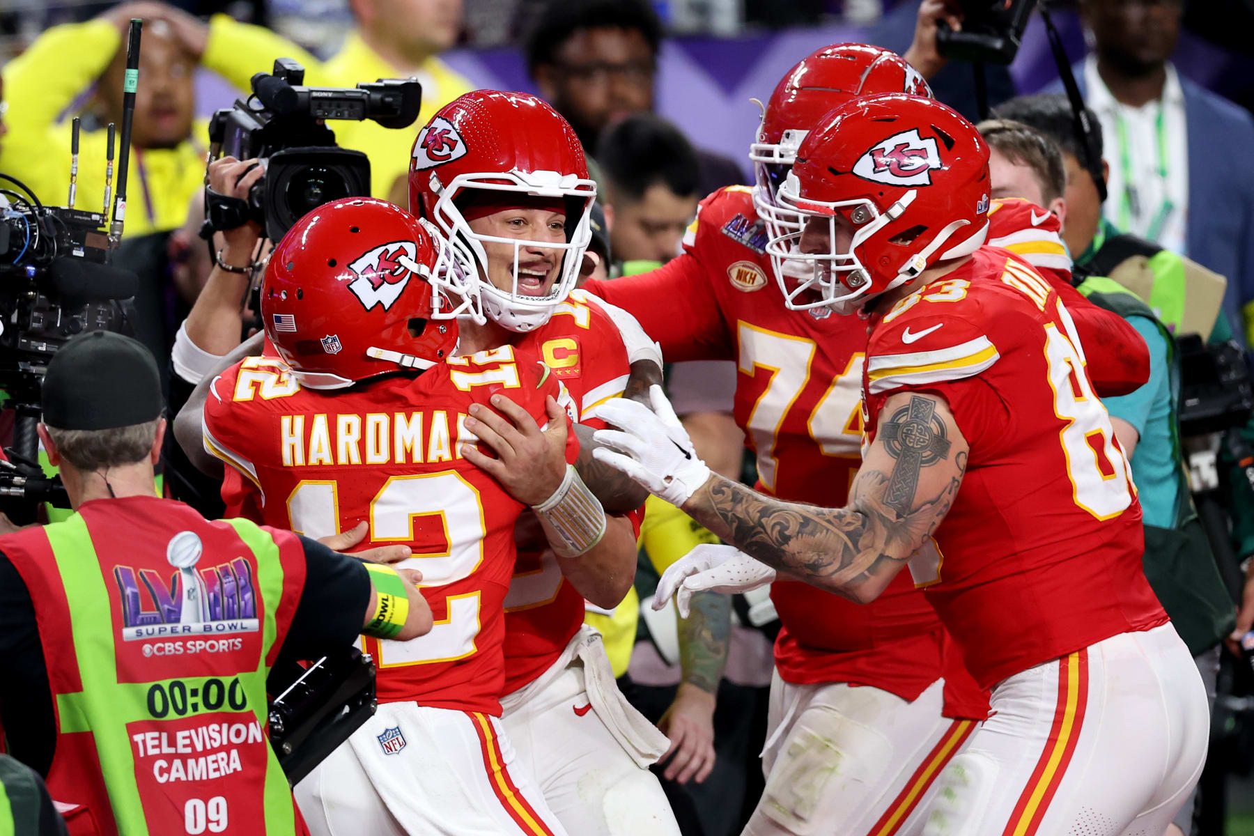 LAS VEGAS, NEVADA - FEBRUARY 11: Mecole Hardman Jr. #12 of the Kansas City Chiefs celebrates with Patrick Mahomes #15 and other teammates after scoring the game-winning touchdown in overtime to defeat the San Francisco 49ers 25-22 during Super Bowl LVIII at Allegiant Stadium on February 11, 2024 in Las Vegas, Nevada. (Photo by Steph Chambers/Getty Images)
