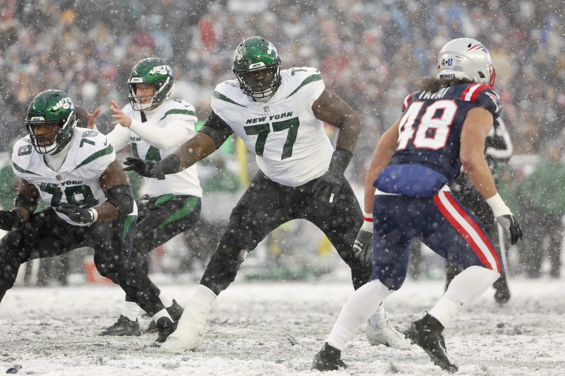 FOXBOROUGH, MA - JANUARY 7: Mekhi Becton #77 of the New York Jets looks to block against the New England Patriots at Gillette Stadium on January 7, 2024 in Foxborough, Massachusetts.(Photo By Winslow Townson/Getty Images)