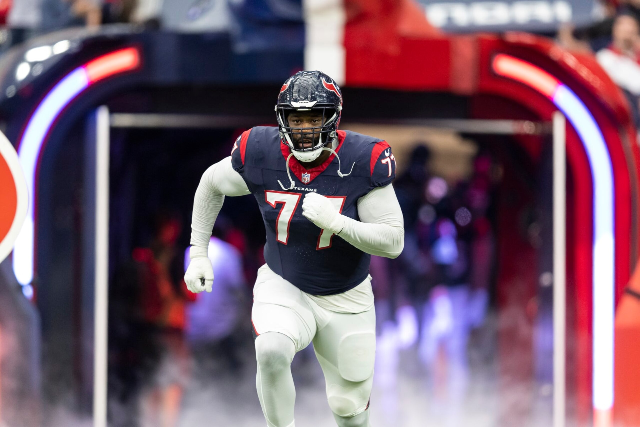 HOUSTON, TEXAS - JANUARY 13: George Fant #77 of the Houston Texans takes the field prior to an NFL wild-card playoff football game between the Houston Texans and the Cleveland Browns at NRG Stadium on January 13, 2024 in Houston, Texas. (Photo by Michael Owens/Getty Images)