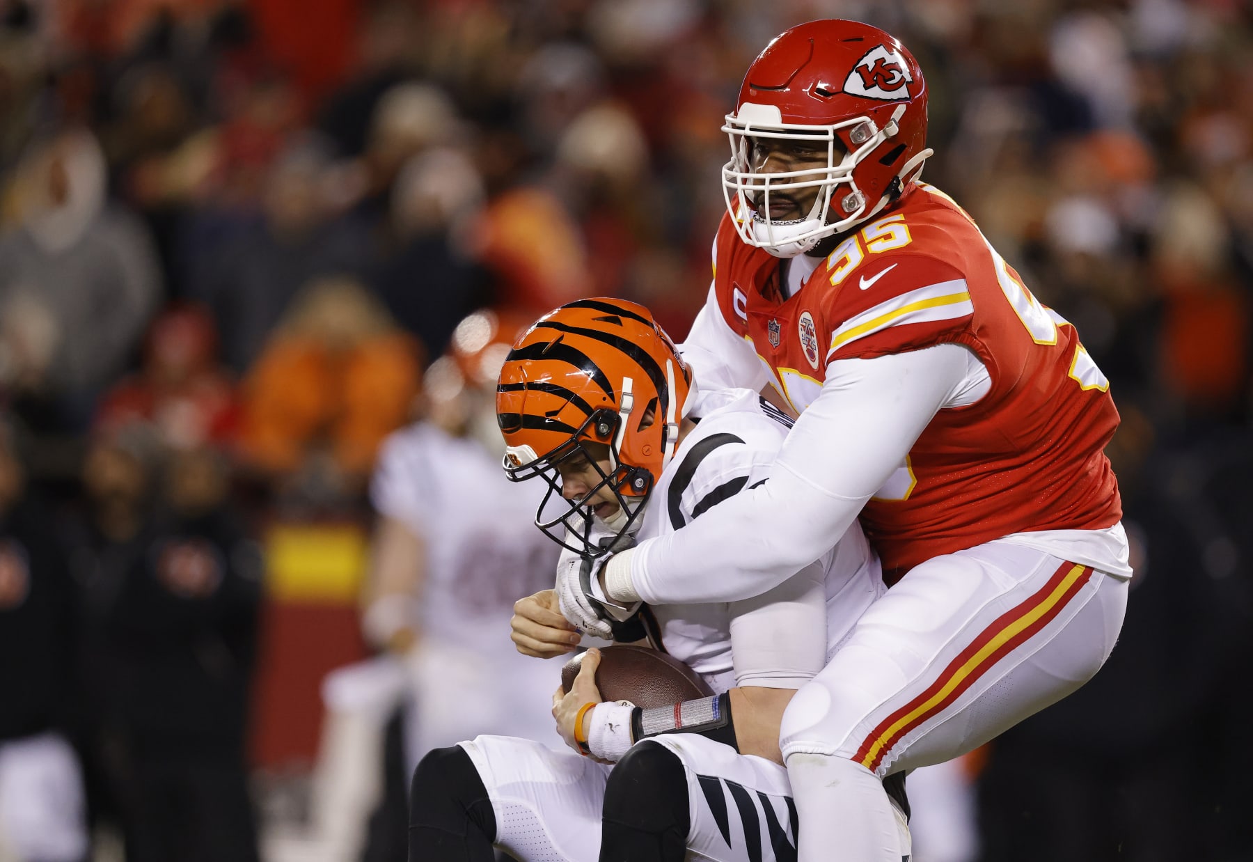KANSAS CITY, MISSOURI - JANUARY 29: Chris Jones #95 of the Kansas City Chiefs sacks Joe Burrow #9 of the Cincinnati Bengals during the first quarter in the AFC Championship Game at GEHA Field at Arrowhead Stadium on January 29, 2023 in Kansas City, Missouri. (Photo by David Eulitt/Getty Images)