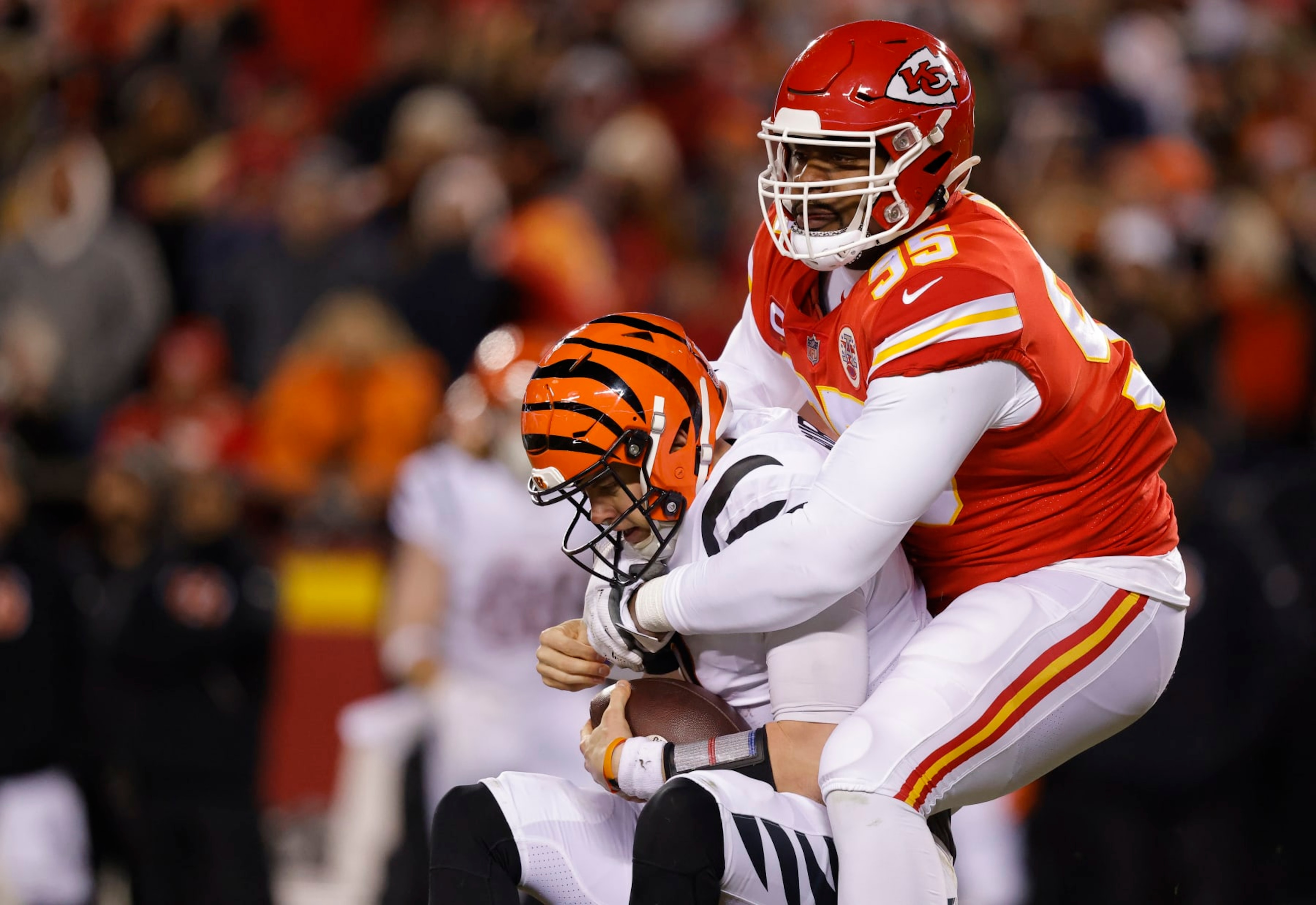 KANSAS CITY, MISSOURI - JANUARY 29: Chris Jones #95 of the Kansas City Chiefs sacks Joe Burrow #9 of the Cincinnati Bengals during the first quarter in the AFC Championship Game at GEHA Field at Arrowhead Stadium on January 29, 2023 in Kansas City, Missouri. (Photo by David Eulitt/Getty Images)