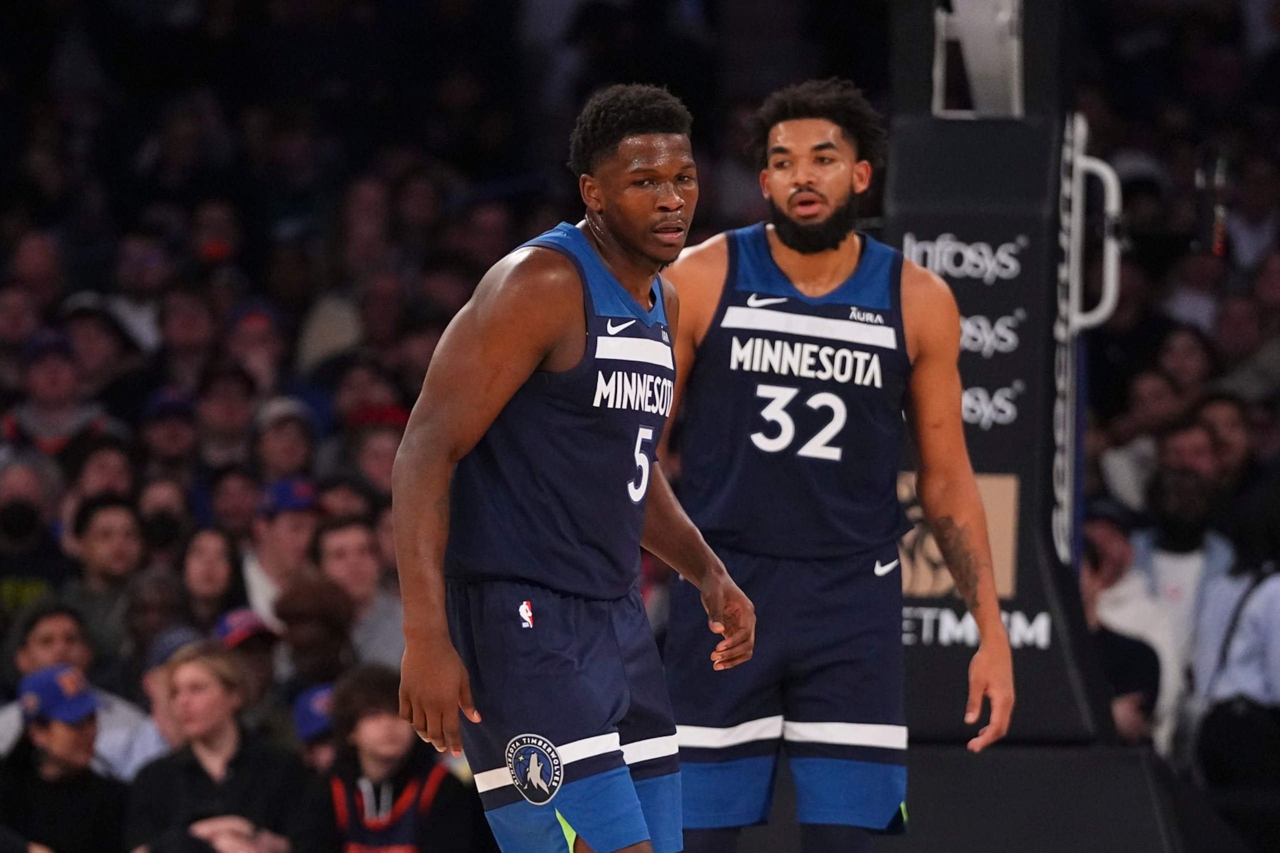 NEW YORK, NEW YORK - JANUARY 1: Anthony Edwards #5 and Karl-Anthony Towns #32 of the Minnesota Timberwolves look on against the New York Knicks at Madison Square Garden on January 1, 2024 in New York City. The Knicks defeated the Timberwolves 112-106. NOTE TO USER: User expressly acknowledges and agrees that, by downloading and or using this photograph, User is consenting to the terms and conditions of the Getty Images License Agreement. (Photo by Mitchell Leff/Getty Images)