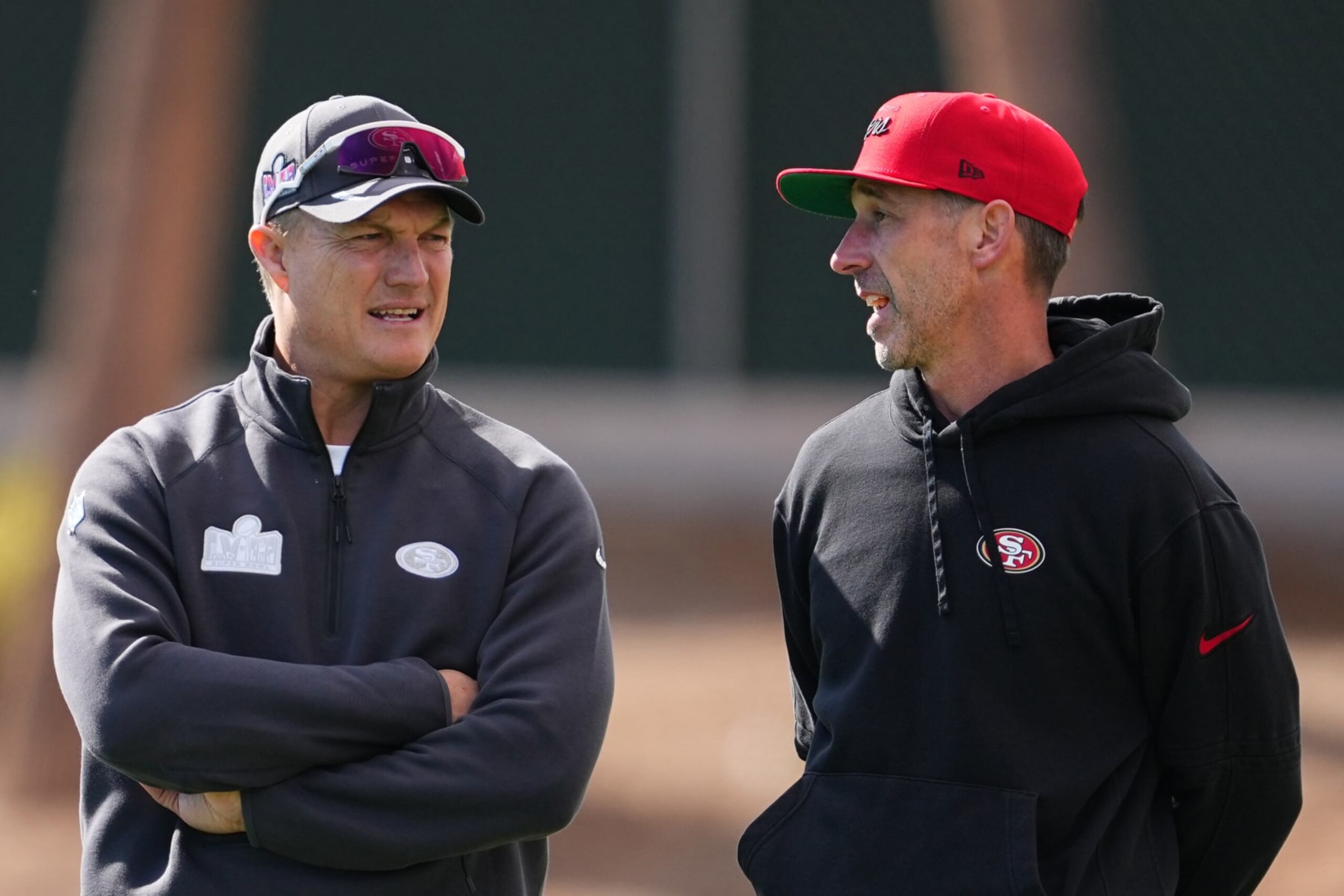 LAS VEGAS, NEVADA - FEBRUARY 07: (L-R) General manager John Lynch and head coach Kyle Shanahan speak during San Francisco 49ers practice ahead of Super Bowl LVIII at Fertitta Football Complex on February 07, 2024 in Las Vegas, Nevada. (Photo by Chris Unger/Getty Images)