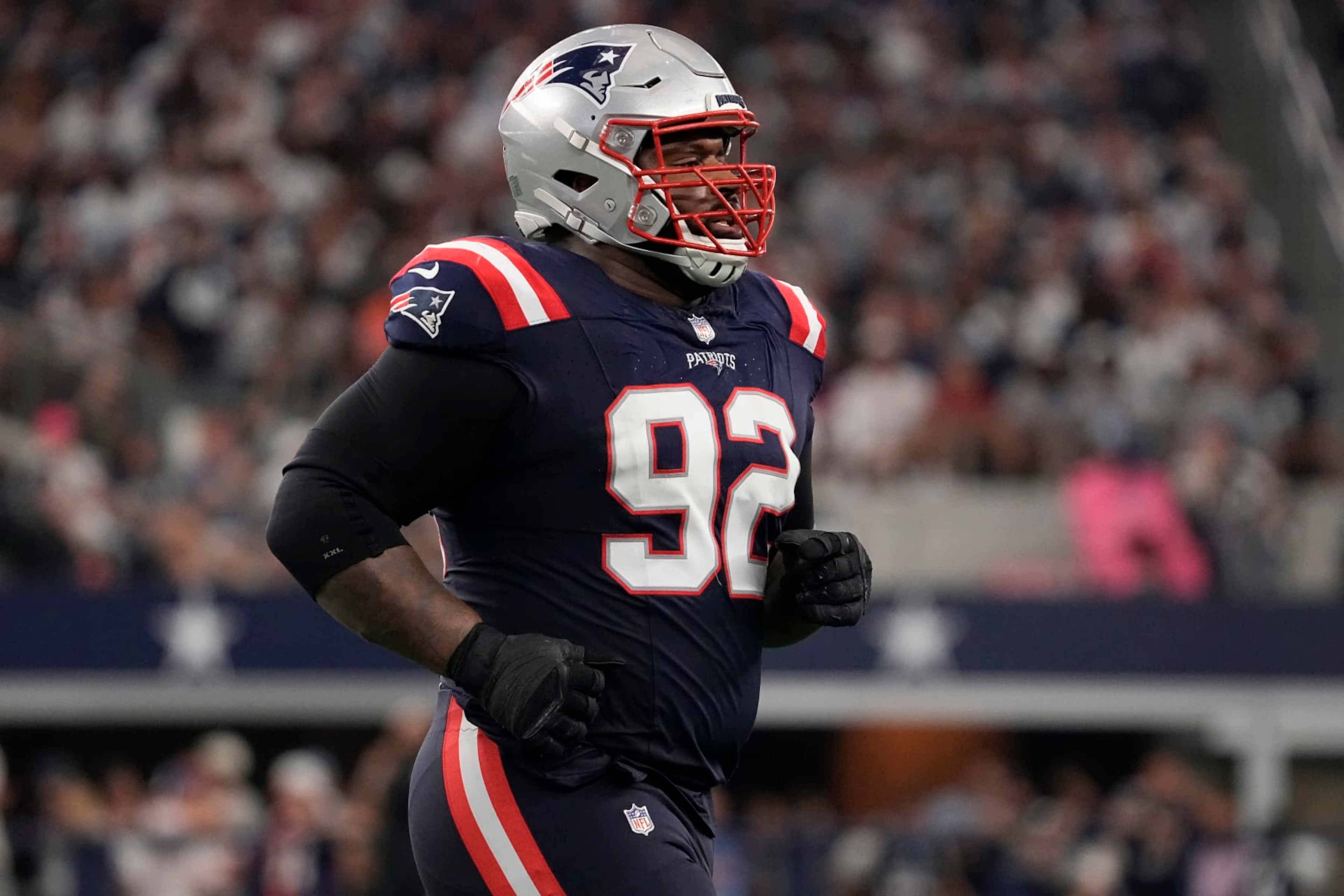 ARLINGTON, TEXAS - OCTOBER 01: Davon Godchaux #92 of the New England Patriots runs off the field during the second half against the Dallas Cowboys at AT&T Stadium on October 01, 2023 in Arlington, Texas. (Photo by Sam Hodde/Getty Images) ARLINGTON, TEXAS - OCTOBER 01: Davon Godchaux #92 of the New England Patriots runs off the field during the second half against the Dallas Cowboys at AT&T Stadium on October 01, 2023 in Arlington, Texas. (Photo by Sam Hodde/Getty Images)