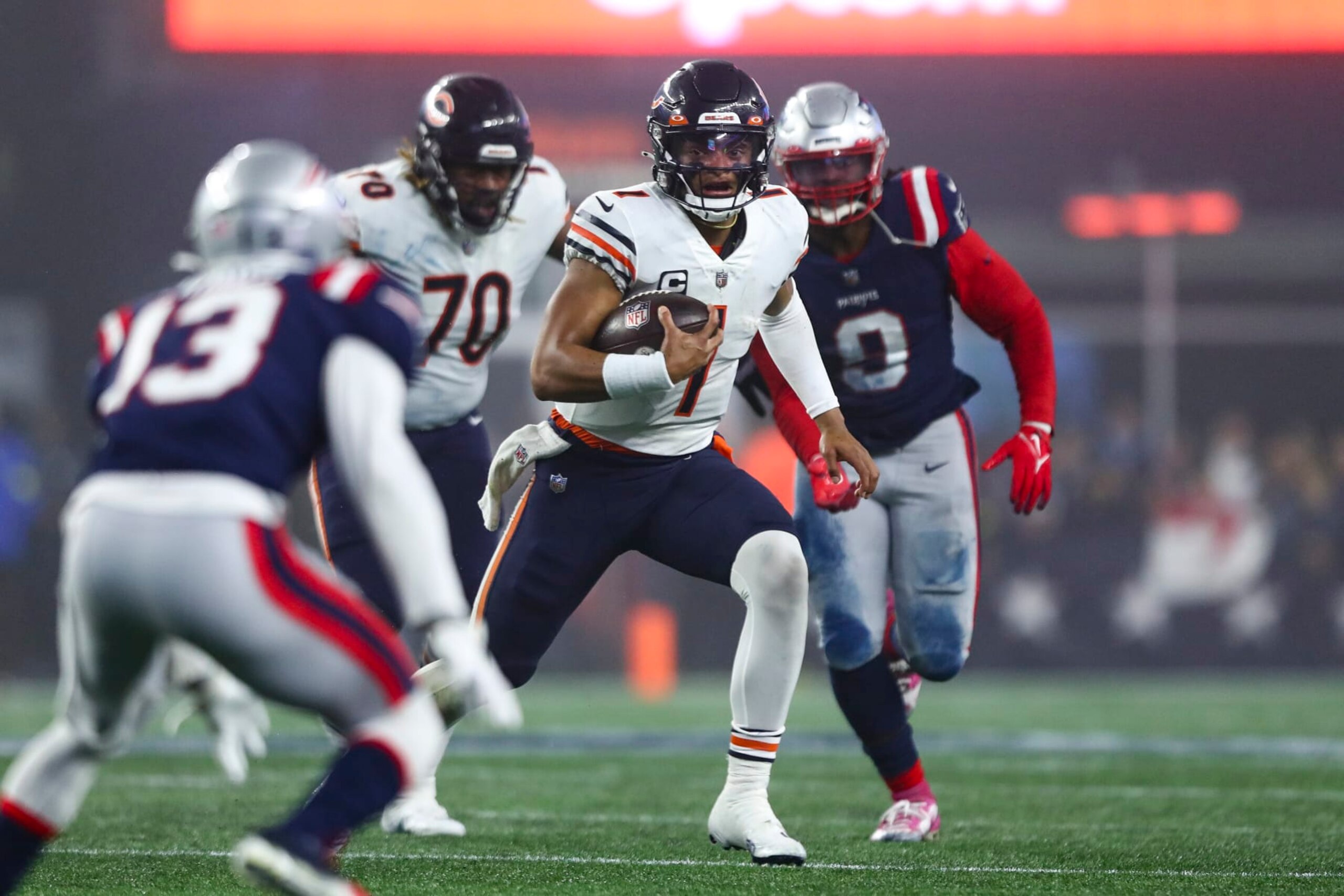 FOXBOROUGH, MA - OCTOBER 24: Justin Fields #1 of the Chicago Bears carries the ball during an NFL football game against the New England Patriots at Gillette Stadium on October 24, 2022 in Foxborough, Massachusetts. (Photo by Kevin Sabitus/Getty Images) FOXBOROUGH, MA - OCTOBER 24: Justin Fields #1 of the Chicago Bears carries the ball during an NFL football game against the New England Patriots at Gillette Stadium on October 24, 2022 in Foxborough, Massachusetts. (Photo by Kevin Sabitus/Getty Images)