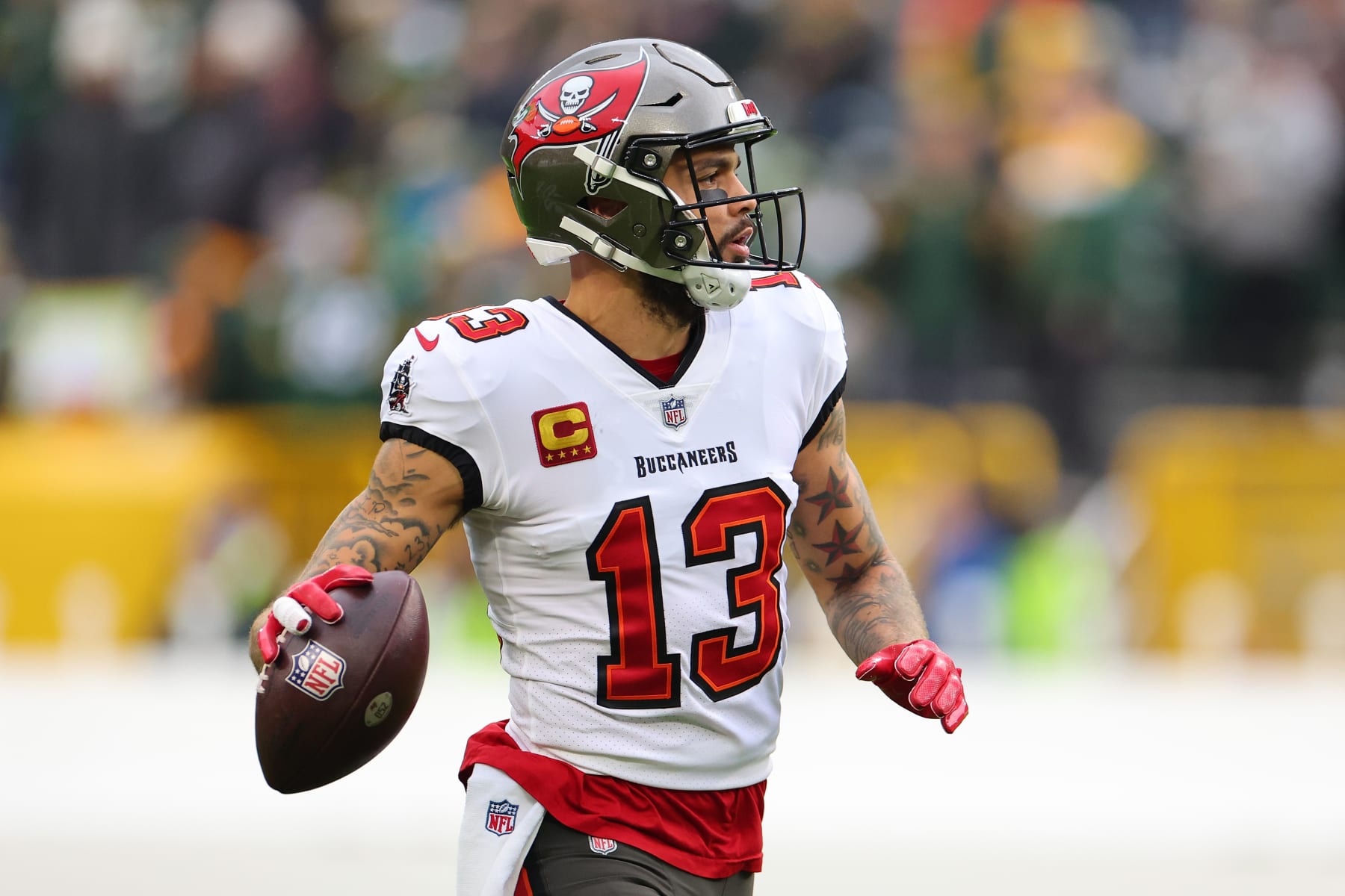 GREEN BAY, WISCONSIN - DECEMBER 17: Mike Evans #13 of the Tampa Bay Buccaneers participates in warmups prior to a game against the Green Bay Packers at Lambeau Field on December 17, 2023 in Green Bay, Wisconsin.  The Buccaneers defeated the Packers 34-20.   (Photo by Stacy Revere/Getty Images)