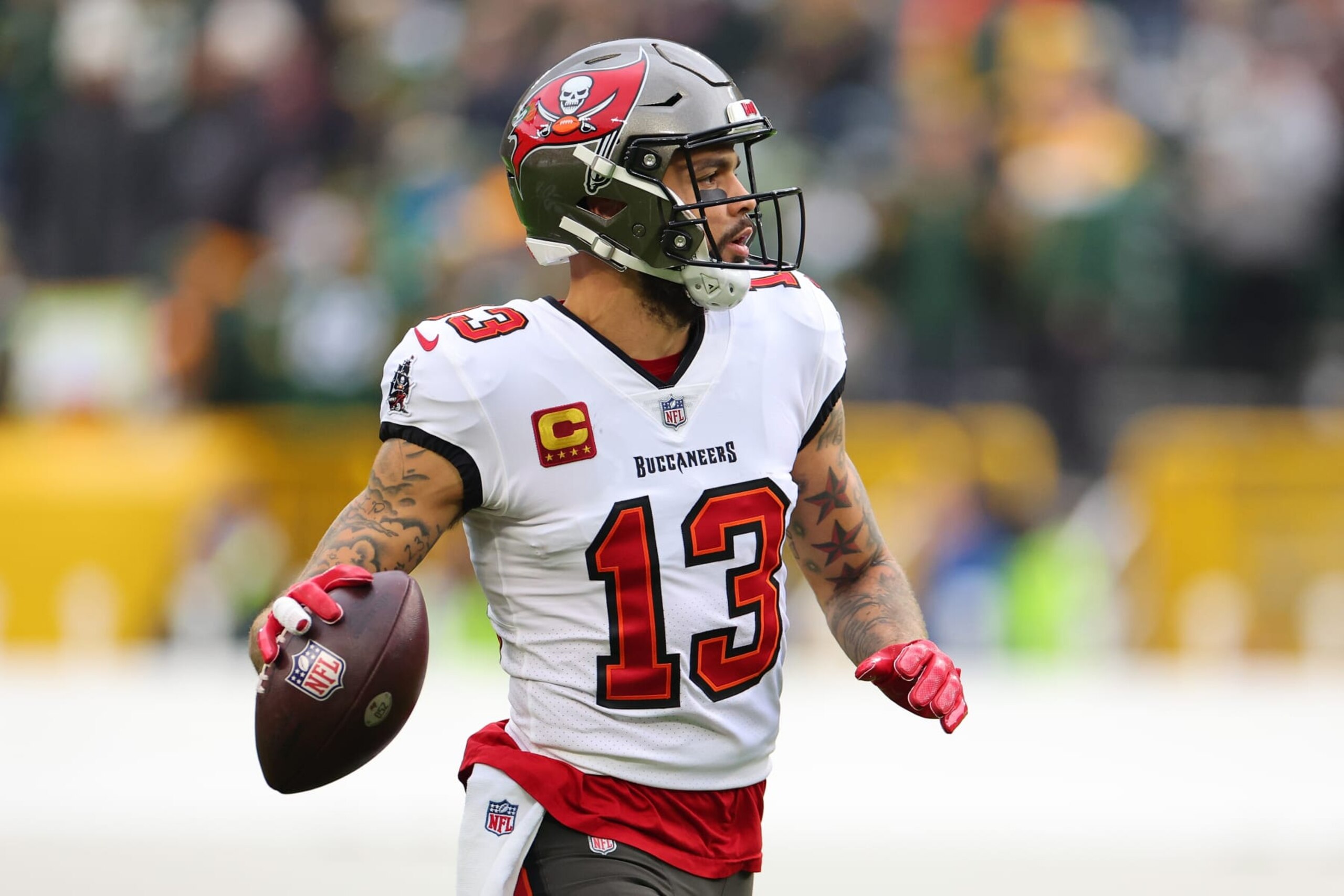 GREEN BAY, WISCONSIN - DECEMBER 17: Mike Evans #13 of the Tampa Bay Buccaneers participates in warmups prior to a game against the Green Bay Packers at Lambeau Field on December 17, 2023 in Green Bay, Wisconsin.  The Buccaneers defeated the Packers 34-20.   (Photo by Stacy Revere/Getty Images)
