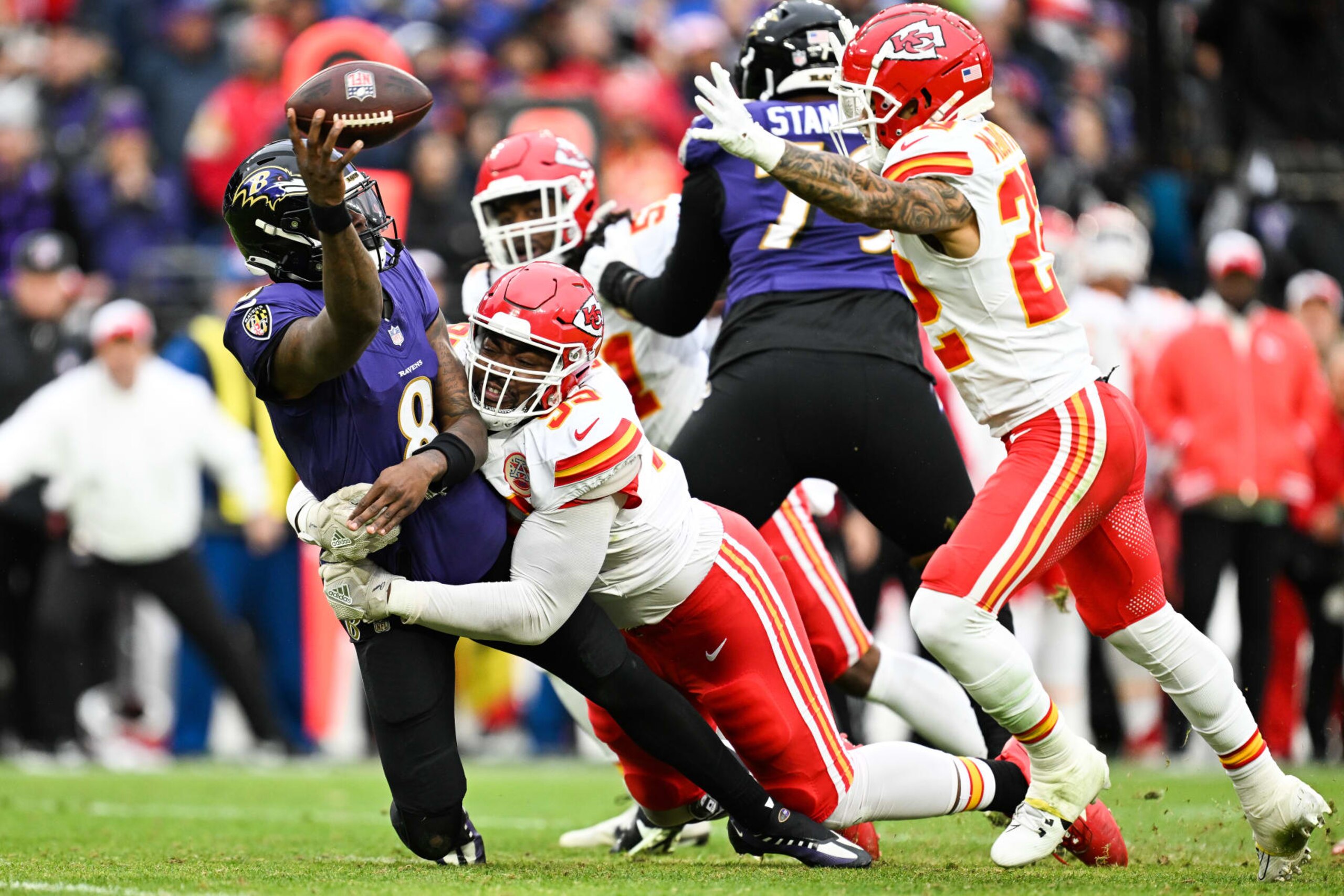BALTIMORE, MD - JANUARY 28: Lamar Jackson #8 of the Baltimore Ravens is tackled by Chris Jones #95 of the Kansas City Chiefs during the first half of the AFC Championship game at M&T Bank Stadium on January 28, 2024 in Baltimore, Maryland. (Photo by Kathryn Riley/Getty Images)