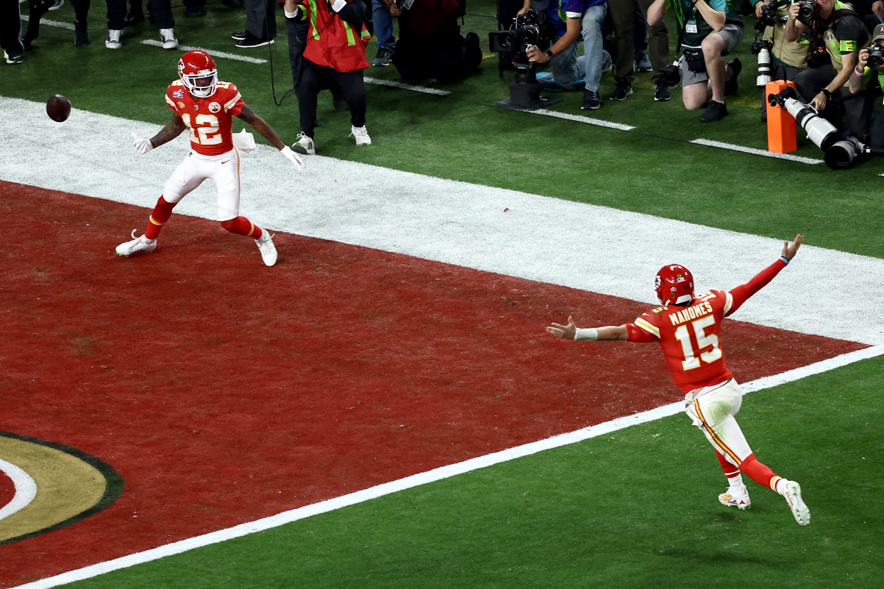 LAS VEGAS, NEVADA - FEBRUARY 11: Mecole Hardman Jr. #12 of the Kansas City Chiefs celebrates with Patrick Mahomes #15 after scoring the game-winning touchdown in overtime to defeat the San Francisco 49ers 25-22 during Super Bowl LVIII at Allegiant Stadium on February 11, 2024 in Las Vegas, Nevada. (Photo by Tim Nwachukwu/Getty Images)