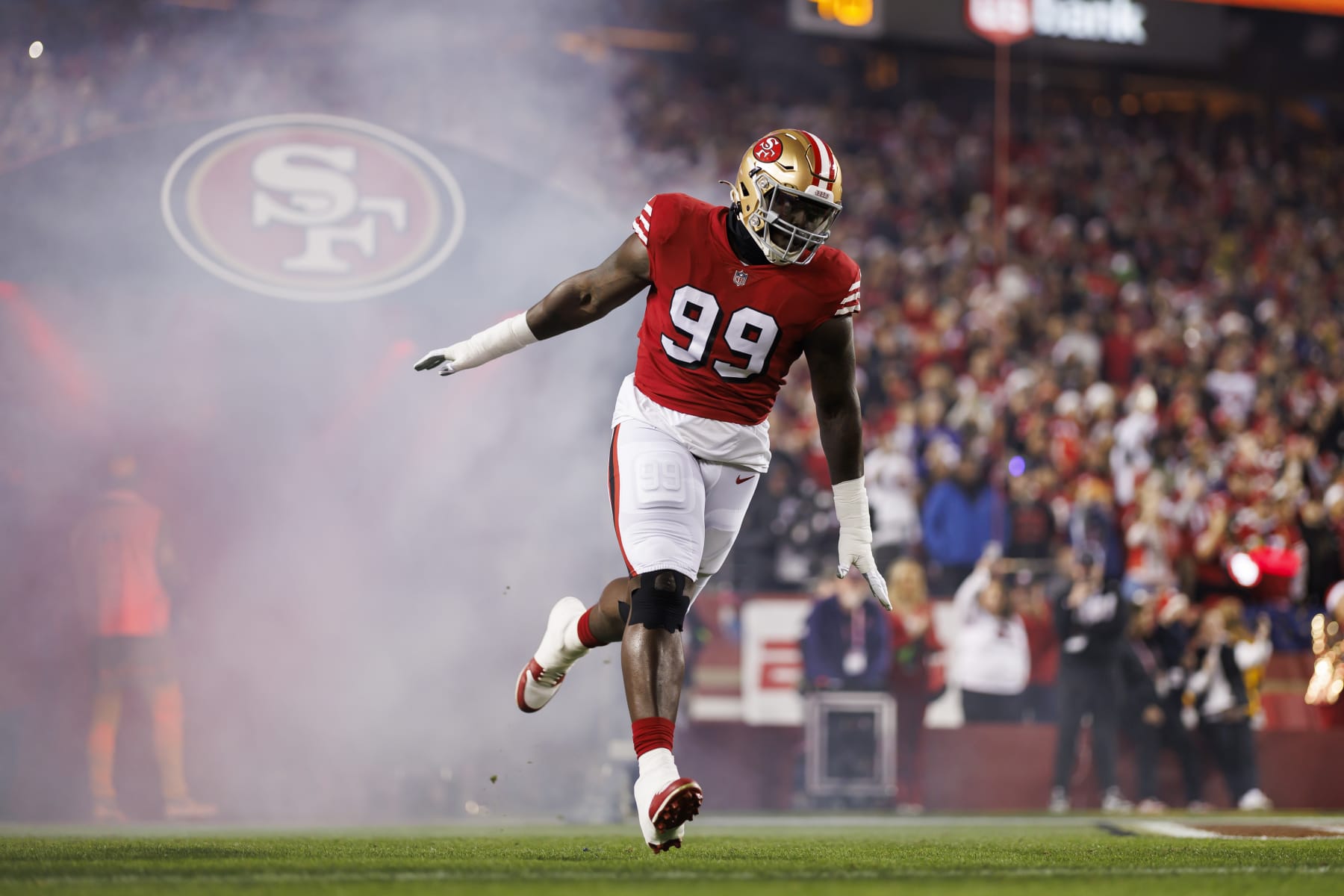 SANTA CLARA, CALIFORNIA - DECEMBER 25: Javon Kinlaw #99 of the San Francisco 49ers celebrates as he runs onto the field during player introductions before an NFL football game against the Baltimore Ravens at Levi's Stadium on December 25, 2023 in Santa Clara, California. (Photo by Ryan Kang/Getty Images)