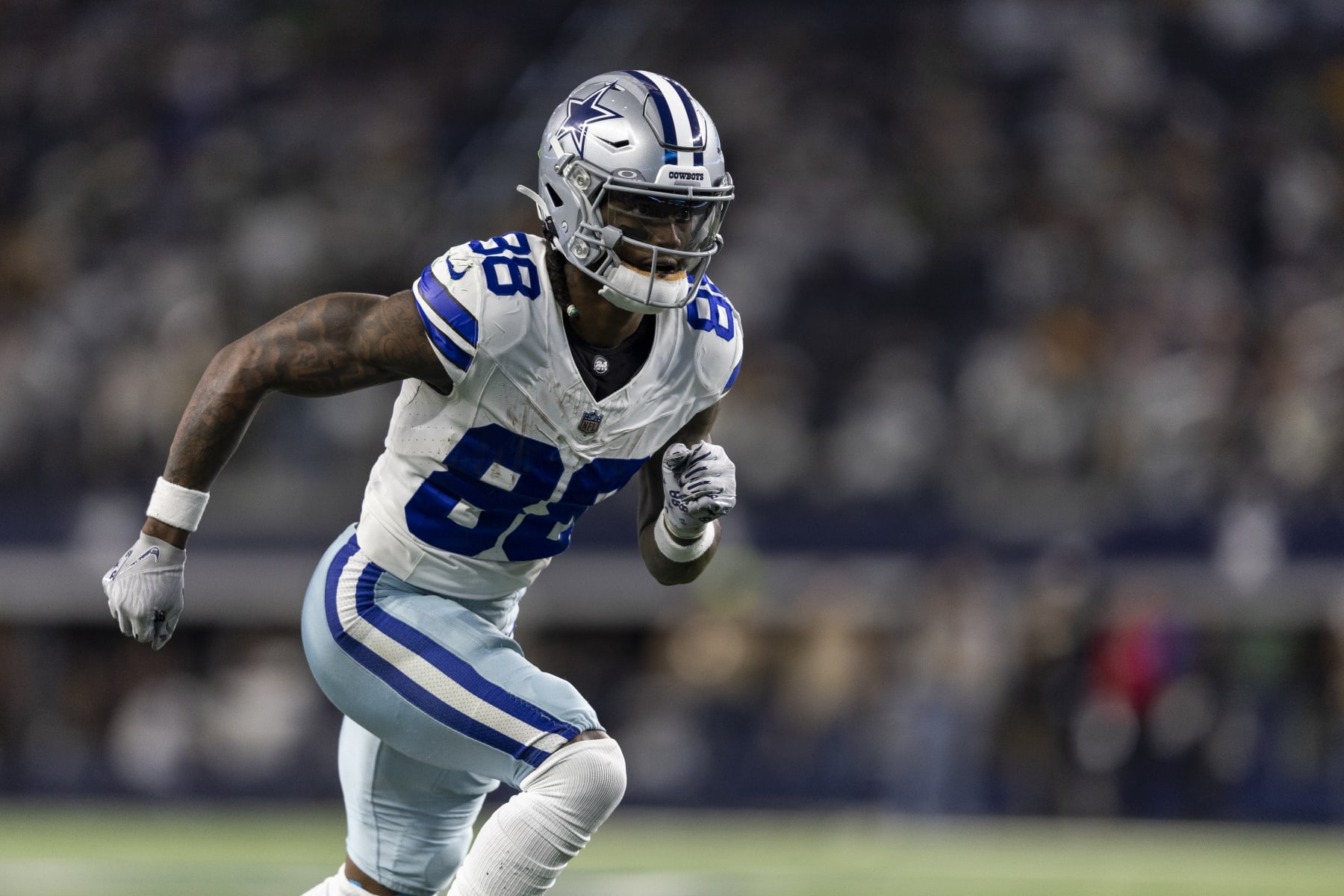 ARLINGTON, TEXAS - JANUARY 14: CeeDee Lamb #88 of the Dallas Cowboys runs a route during an NFL wild-card playoff football game between the Dallas Cowboys and the Green Bay Packers at AT&T Stadium on January 14, 2024 in Arlington, Texas. (Photo by Michael Owens/Getty Images)