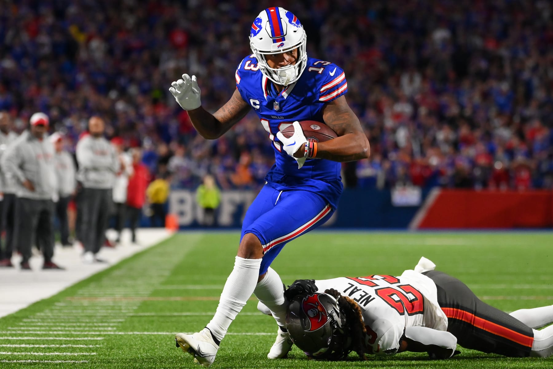 ORCHARD PARK, NEW YORK - OCTOBER 26: Gabe Davis #13 of the Buffalo Bills avoids the tackle attempt of Ryan Neal #23 of the Tampa Bay Buccaneers during the second half at Highmark Stadium on October 26, 2023 in Orchard Park, New York. (Photo by Rich Barnes/Getty Images)