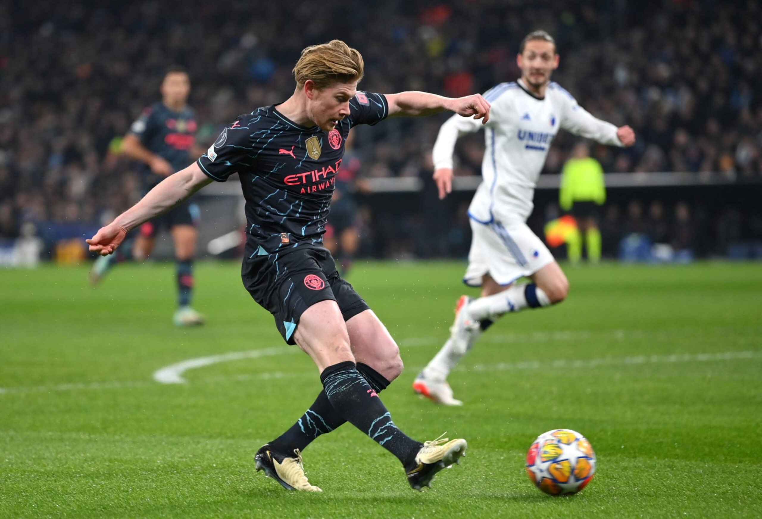COPENHAGEN, DENMARK - FEBRUARY 13: Kevin De Bruyne of Manchester City scores his team's first goal during the UEFA Champions League 2023/24 round of 16 first leg match between F.C. Copenhagen and Manchester City at Parken Stadium on February 13, 2024 in Copenhagen, Denmark. (Photo by Justin Setterfield/Getty Images)