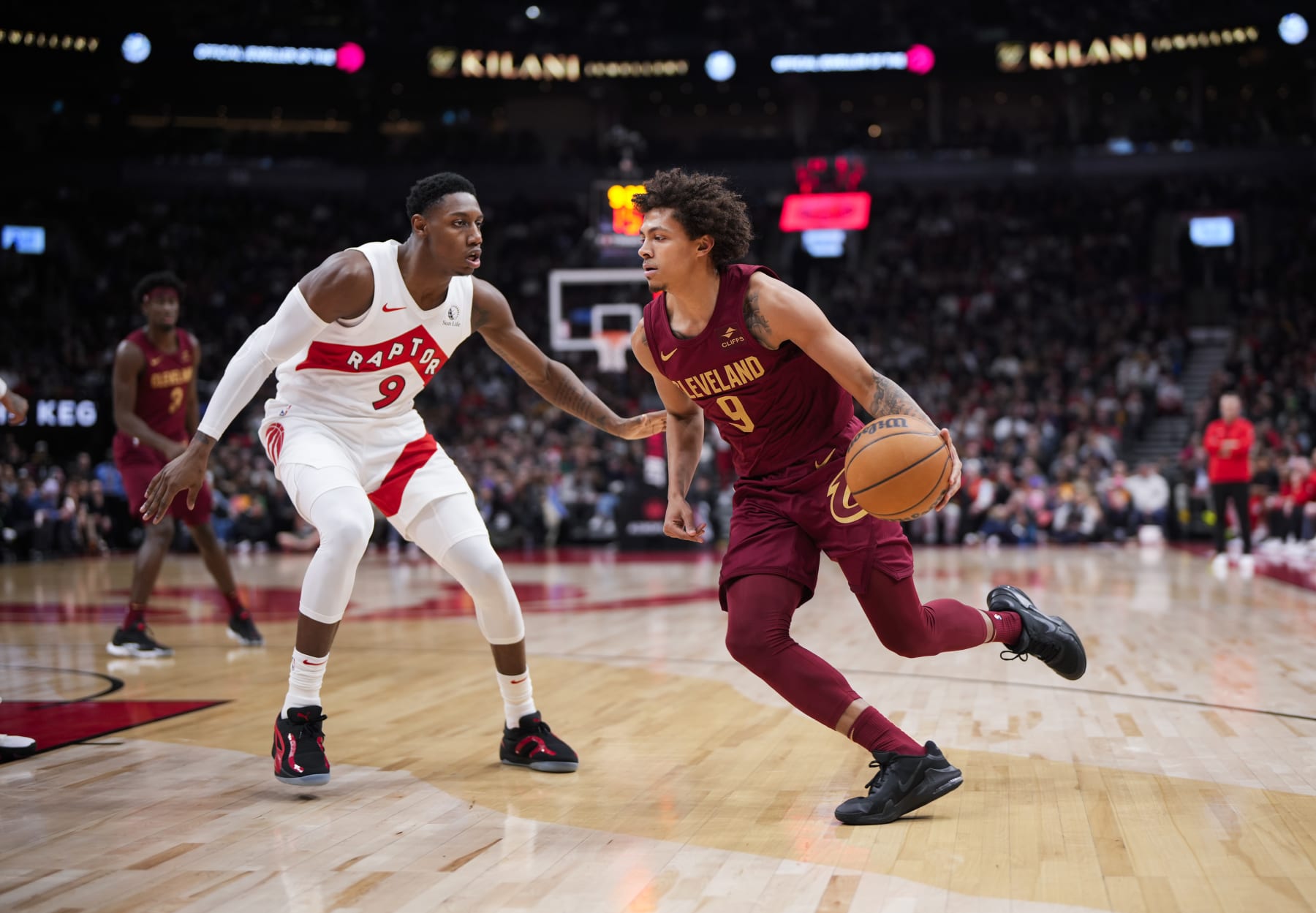 TORONTO, ON - JANUARY 1: Craig Porter Jr. #9 of Cleveland Cavaliers drives against RJ Barrett #9 of the Toronto Raptors during the first half of their basketball game at the Scotiabank Arena on January 1, 2024 in Toronto, Ontario, Canada. NOTE TO USER: User expressly acknowledges and agrees that, by downloading and/or using this Photograph, user is consenting to the terms and conditions of the Getty Images License Agreement. (Photo by Mark Blinch/Getty Images)