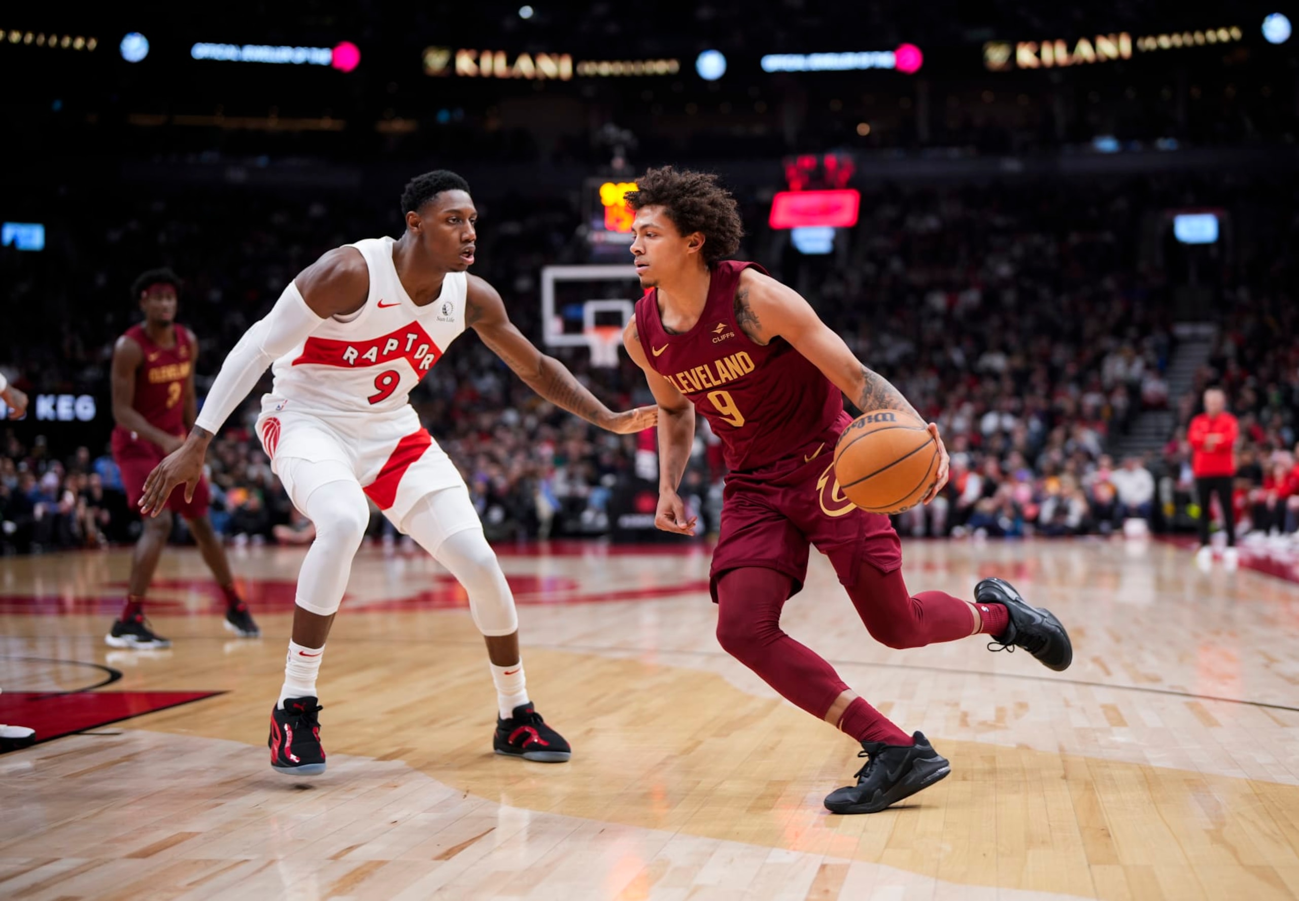 TORONTO, ON - JANUARY 1: Craig Porter Jr. #9 of Cleveland Cavaliers drives against RJ Barrett #9 of the Toronto Raptors during the first half of their basketball game at the Scotiabank Arena on January 1, 2024 in Toronto, Ontario, Canada. NOTE TO USER: User expressly acknowledges and agrees that, by downloading and/or using this Photograph, user is consenting to the terms and conditions of the Getty Images License Agreement. (Photo by Mark Blinch/Getty Images)