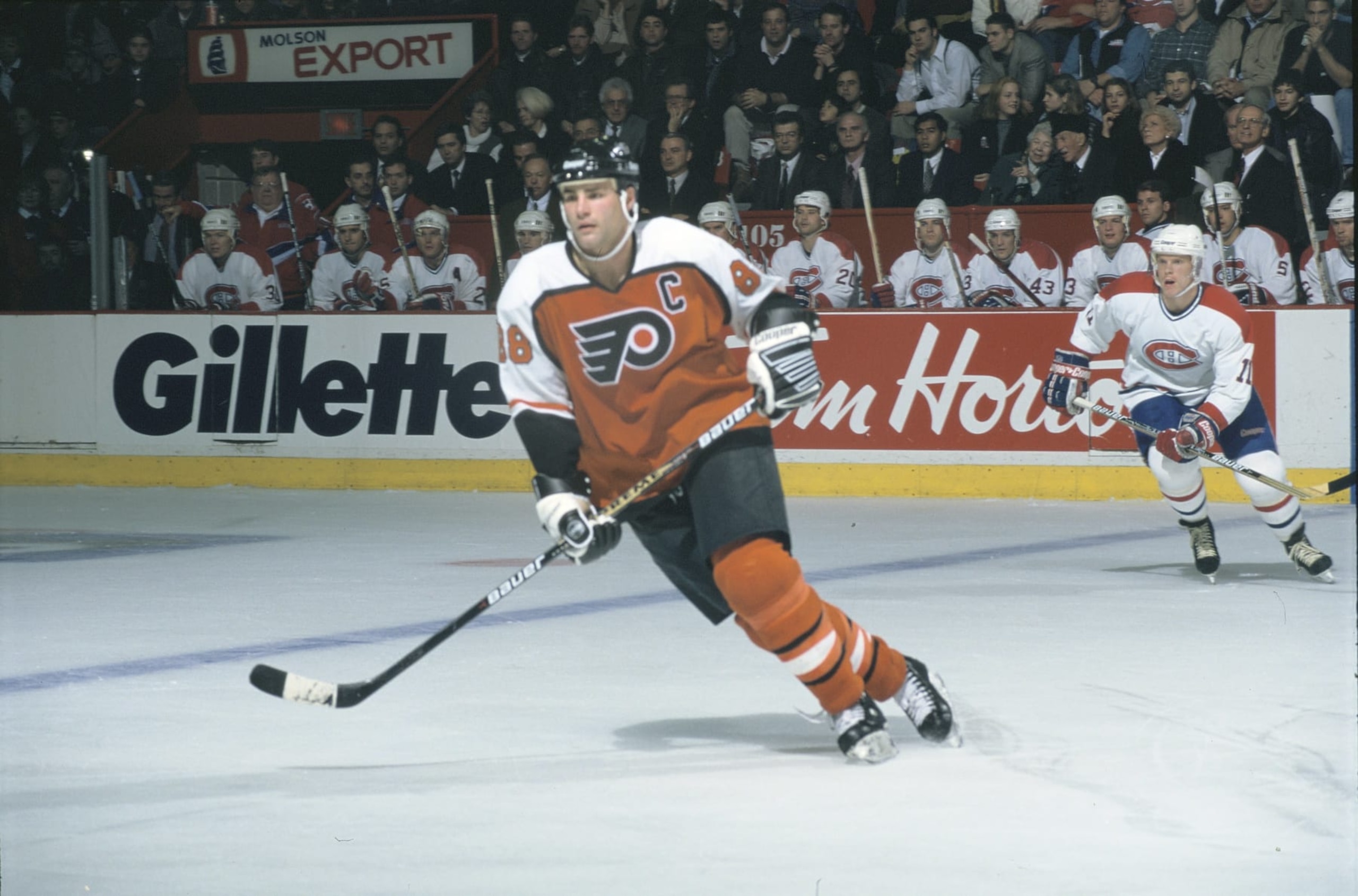 Flyers captain Eric Lindros #88 and Canadiens forward Saku Koivu #11 in a game at the Montreal Forum during the 1995-96 season (Photo by Denis Brodeur/NHLI via Getty Images)