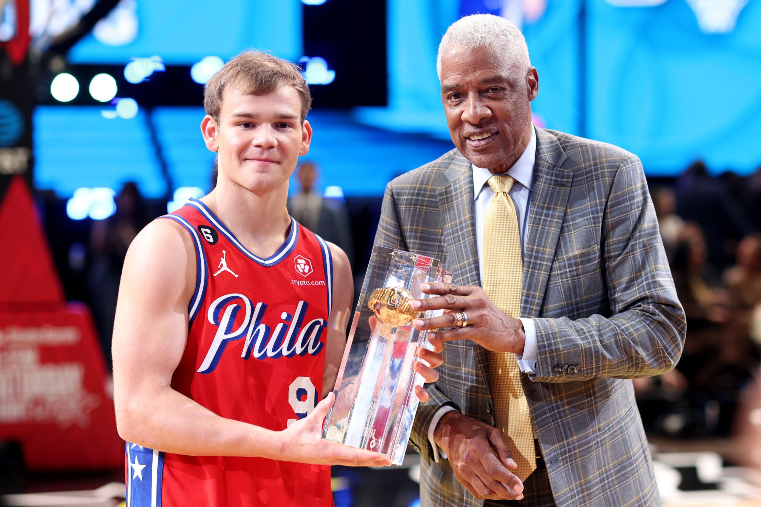 SALT LAKE CITY, UTAH - FEBRUARY 18: Mac McClung #9 of the Philadelphia 76ers and former professional basketball player Julius Erving pose with the trophy after McClung's victory in the 2023 NBA All Star AT&T Slam Dunk Contest at Vivint Arena on February 18, 2023 in Salt Lake City, Utah. NOTE TO USER: User expressly acknowledges and agrees that, by downloading and or using this photograph, User is consenting to the terms and conditions of the Getty Images License Agreement. (Photo by Tim Nwachukwu/Getty Images)