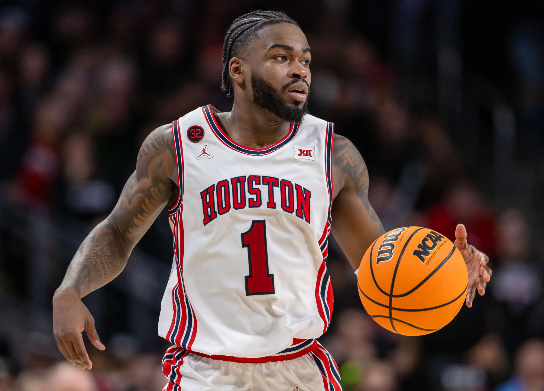 CINCINNATI, OHIO - FEBRUARY 10: Jamal Shead #1 of the Houston Cougars brings the ball up court during the game against the Cincinnati Bearcats at Fifth Third Arena on February 10, 2024 in Cincinnati, Ohio. (Photo by Michael Hickey/Getty Images)