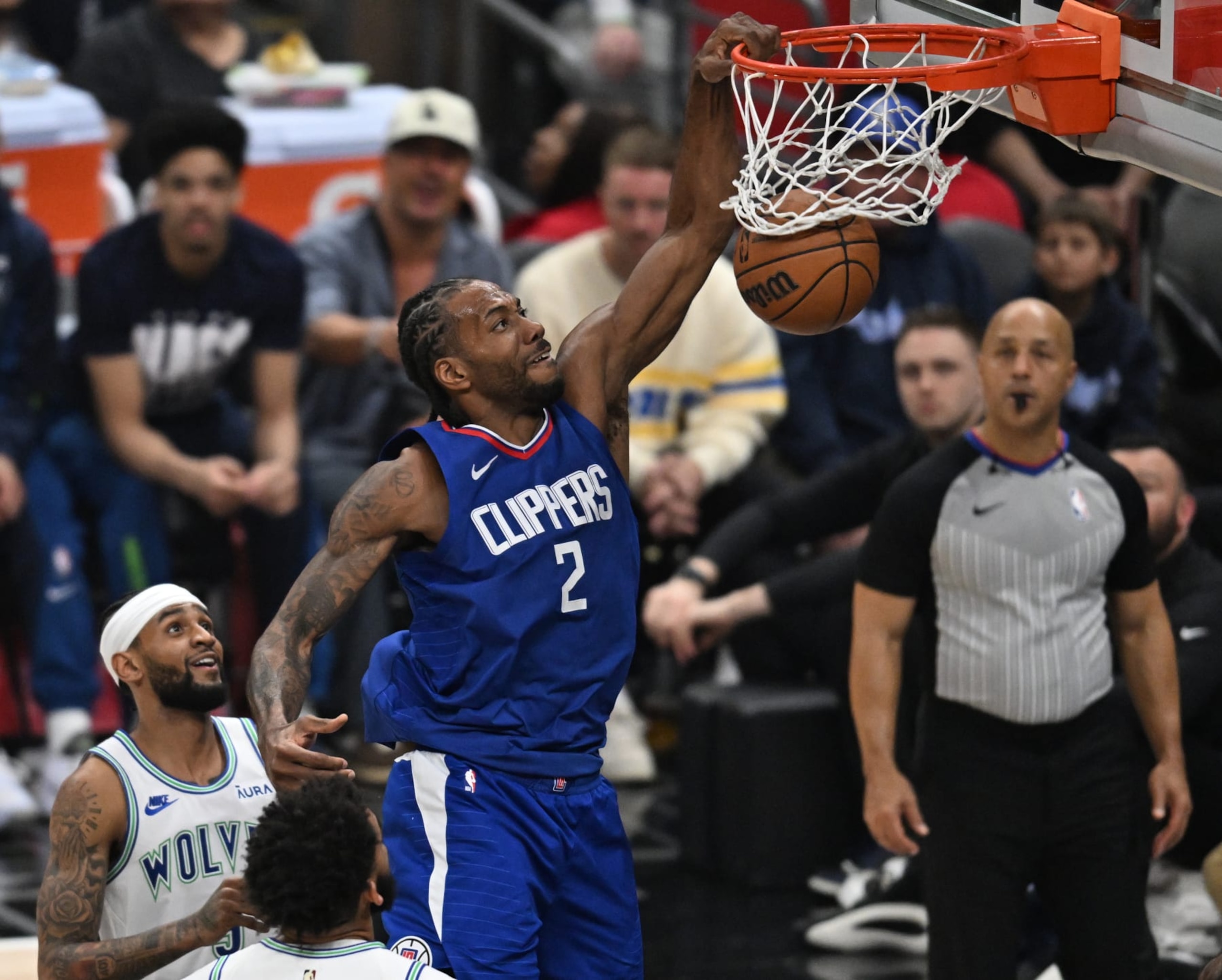 LOS ANGELES, CA - FEBRUARY 12: Los Angeles Clippers Forward Kawhi Leonard (2) dunks as Minnesota Timberwolves Guard Nickeil Alexander-Walker (9) and Karl-Anthony Towns (32) look on during a NBA basketball game at the Crypto.com Arena in Los Angeles, CA.(Photo by John McCoy/Icon Sportswire via Getty Images)(Photo by John McCoy/Icon Sportswire via Getty Images) LOS ANGELES, CA - FEBRUARY 12: Los Angeles Clippers Forward Kawhi Leonard (2) dunks as Minnesota Timberwolves Guard Nickeil Alexander-Walker (9) and Karl-Anthony Towns (32) look on during a NBA basketball game at the Crypto.com Arena in Los Angeles, CA.(Photo by John McCoy/Icon Sportswire via Getty Images)(Photo by John McCoy/Icon Sportswire via Getty Images)