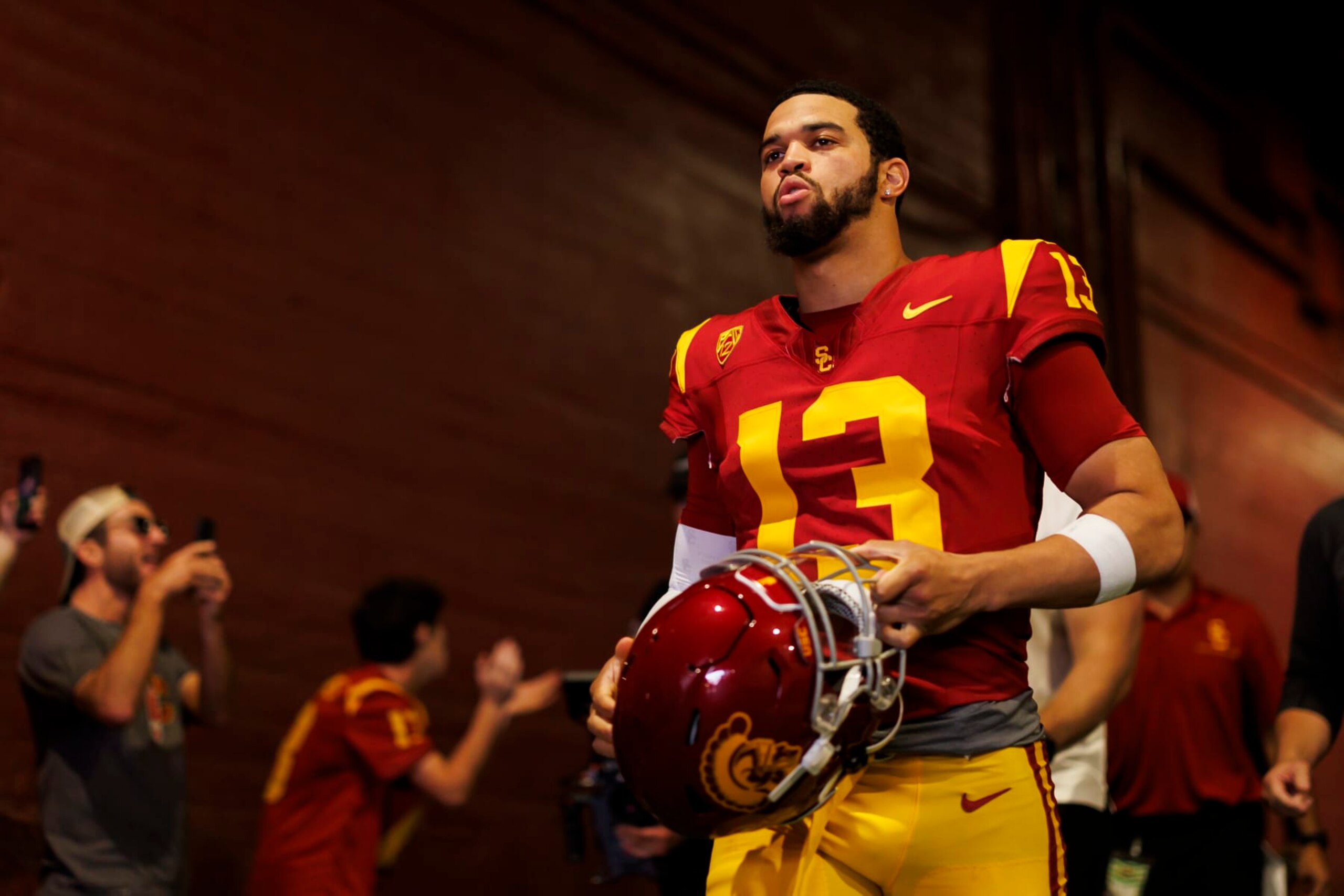 LOS ANGELES, CALIFORNIA - NOVEMBER 18: Caleb Williams #13 of the USC Trojans walks to the field for team entrances prior to a game against the UCLA Bruins at United Airlines Field at the Los Angeles Memorial Coliseum on November 18, 2023 in Los Angeles, California. (Photo by Ryan Kang/Getty Images)