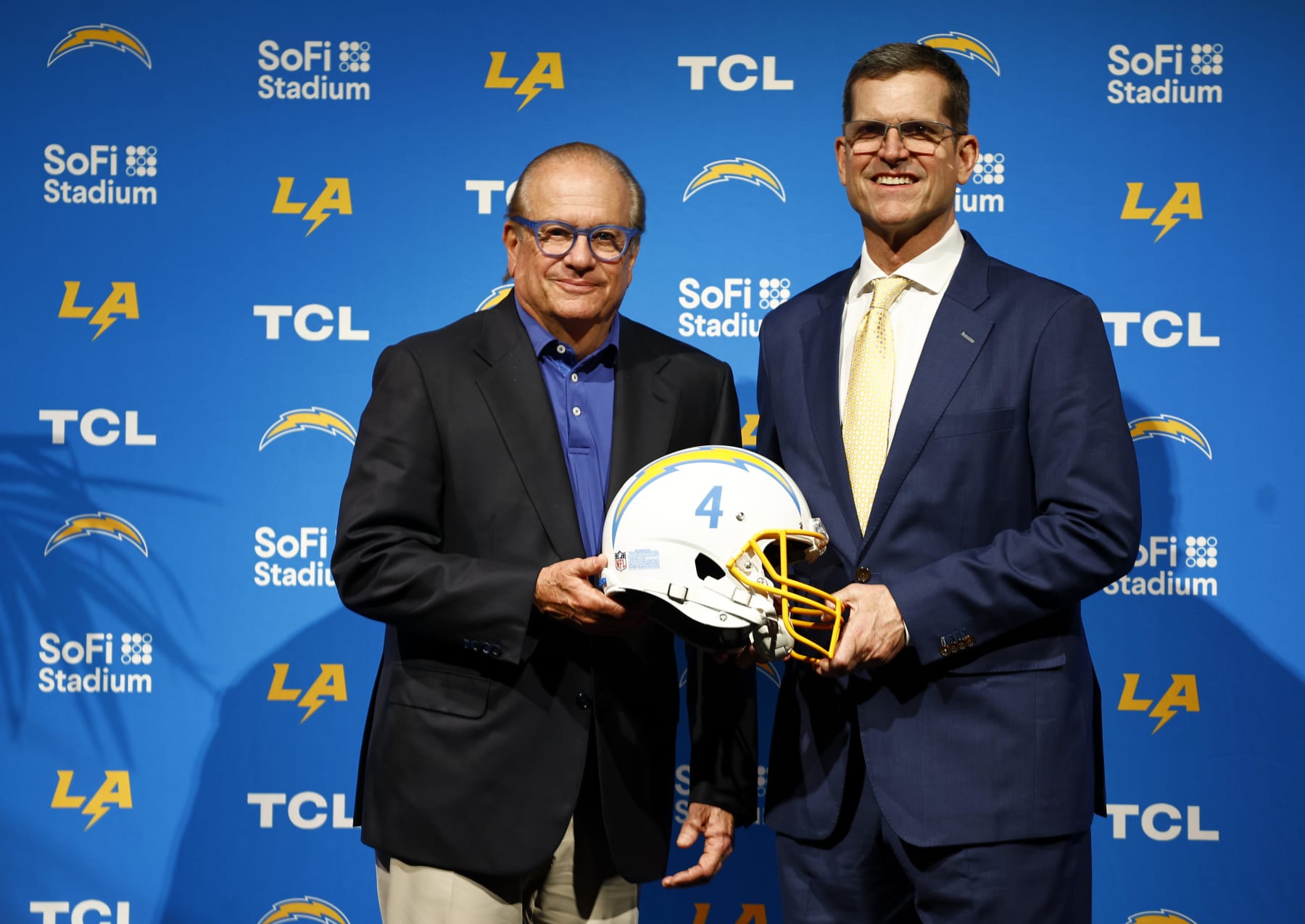 INGLEWOOD, CALIFORNIA - FEBRUARY 01: (L-R) Owner and Chairman of the Board Dean Spanos and Newly appointed head coach Jim Harbaugh of the Los Angeles Chargers pose during a press conference at YouTube Theater on February 01, 2024 in Inglewood, California. (Photo by Ronald Martinez/Getty Images)