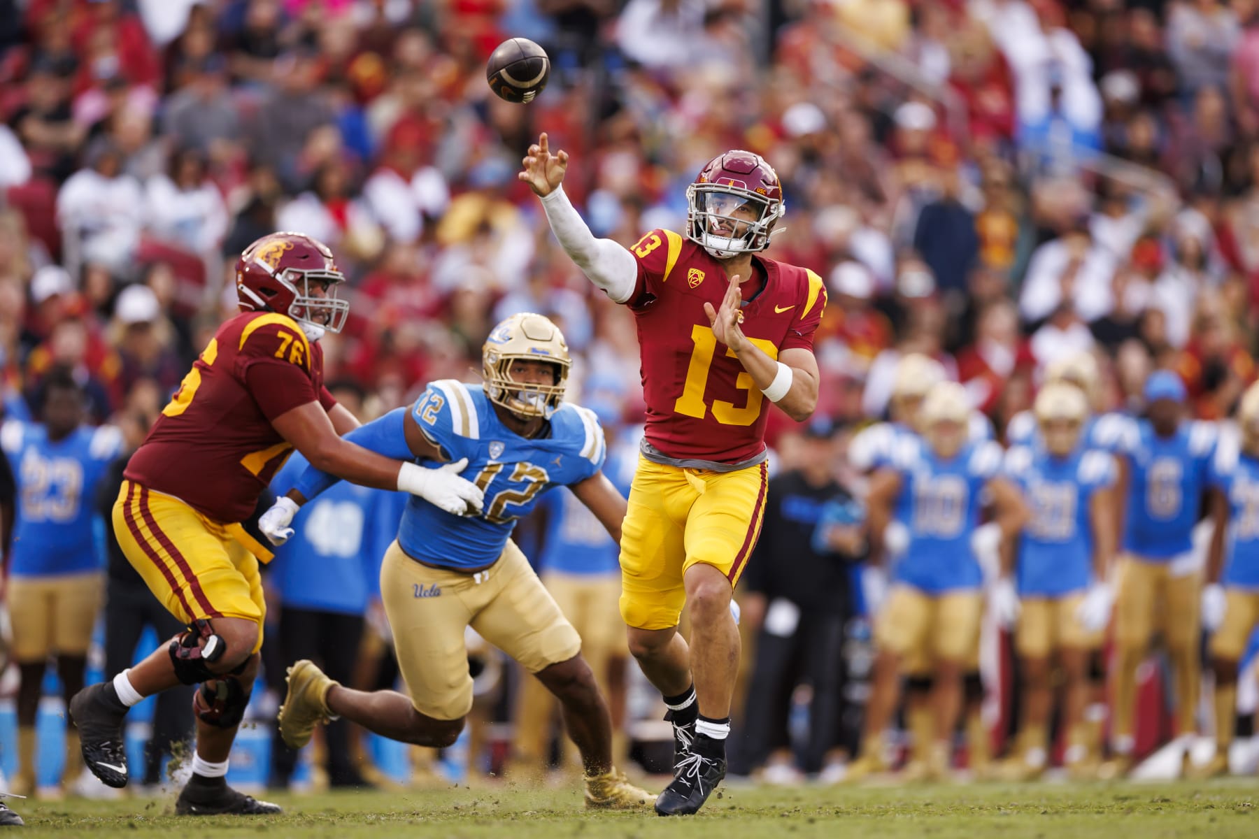 LOS ANGELES, CALIFORNIA - NOVEMBER 18: Caleb Williams #13 of the USC Trojans drops back and looks to throw a pass during the first half of a game against the UCLA Bruins at United Airlines Field at the Los Angeles Memorial Coliseum on November 18, 2023 in Los Angeles, California. (Photo by Ryan Kang/Getty Images)