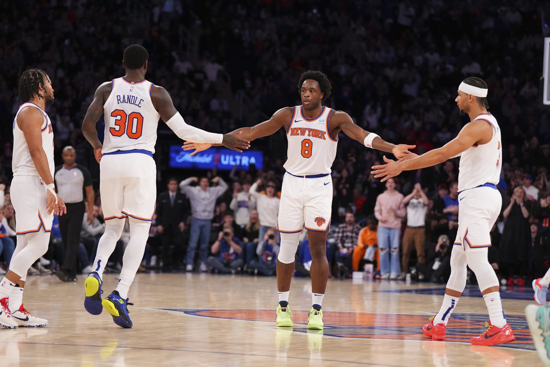 NEW YORK, NEW YORK - JANUARY 1: OG Anunoby #8 of the New York Knicks celebrates with Jalen Brunson #11, Julius Randle #30, and Josh Hart #3 against the Minnesota Timberwolves at Madison Square Garden on January 1, 2024 in New York City. The Knicks defeated the Timberwolves 112-106. NOTE TO USER: User expressly acknowledges and agrees that, by downloading and or using this photograph, User is consenting to the terms and conditions of the Getty Images License Agreement. (Photo by Mitchell Leff/Getty Images)