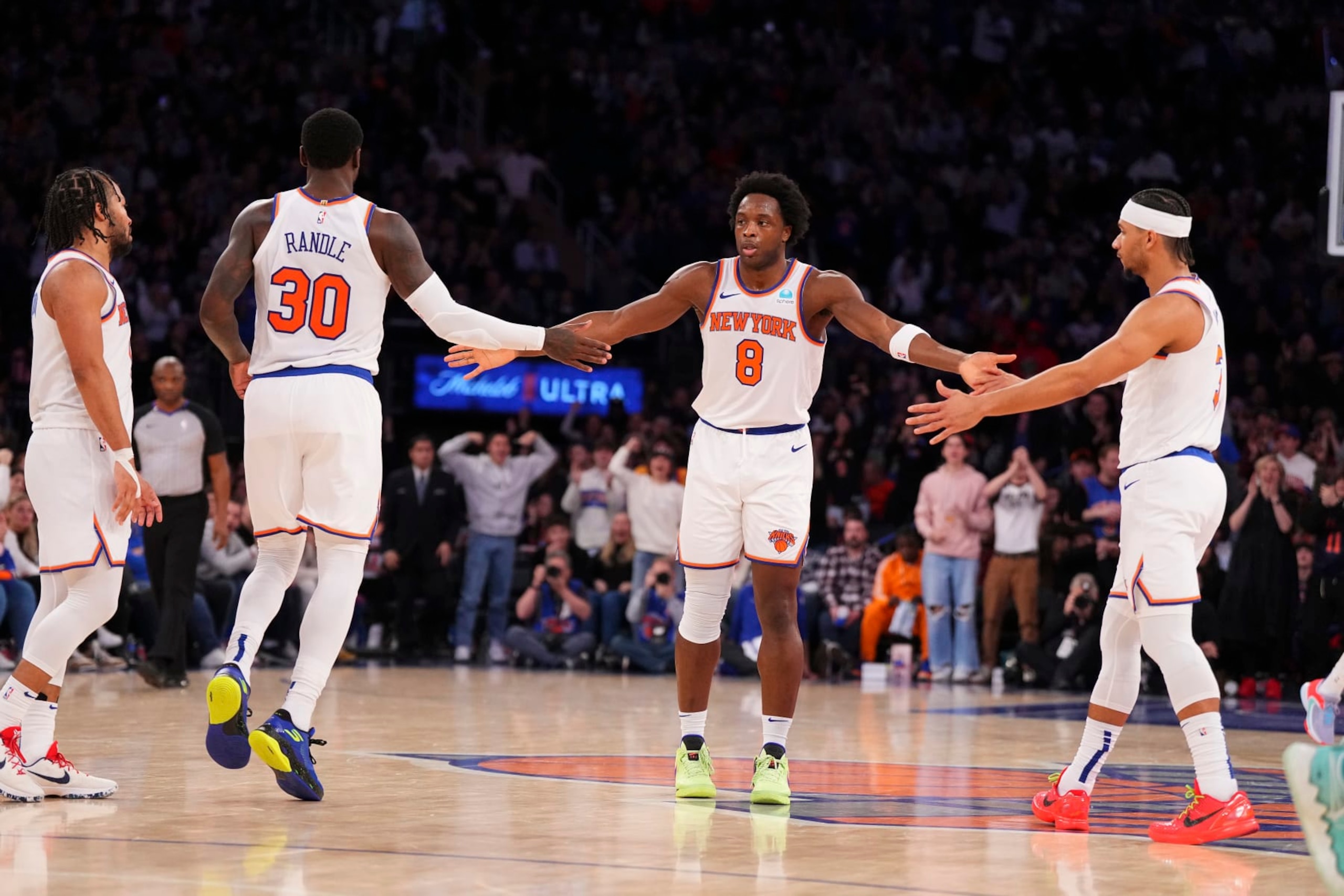 NEW YORK, NEW YORK - JANUARY 1: OG Anunoby #8 of the New York Knicks celebrates with Jalen Brunson #11, Julius Randle #30, and Josh Hart #3 against the Minnesota Timberwolves at Madison Square Garden on January 1, 2024 in New York City. The Knicks defeated the Timberwolves 112-106. NOTE TO USER: User expressly acknowledges and agrees that, by downloading and or using this photograph, User is consenting to the terms and conditions of the Getty Images License Agreement. (Photo by Mitchell Leff/Getty Images)