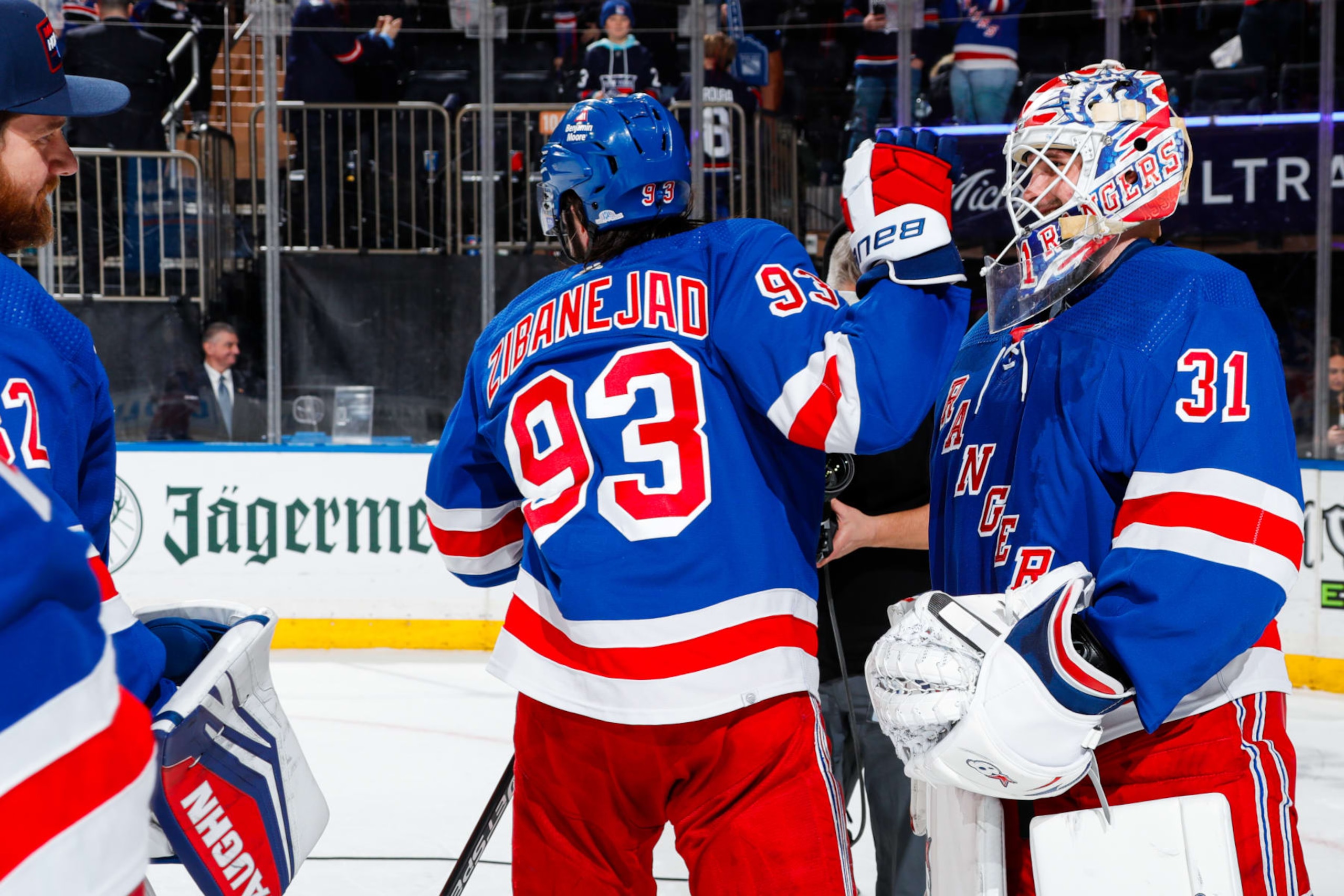 NEW YORK, NEW YORK - FEBRUARY 12:  Igor Shesterkin #31 of the New York Rangers celebrates with teammates after recording a shutout in a 2-0 win against the Calgary Flames at Madison Square Garden on February 12, 2024 in New York City. (Photo by Jared Silber/NHLI via Getty Images)