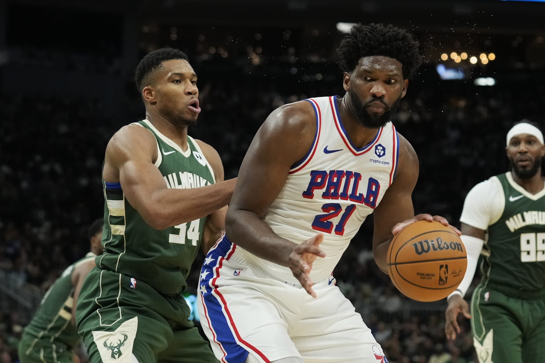 MILWAUKEE, WISCONSIN - OCTOBER 26: Giannis Antetokounmpo #34 of the Milwaukee Bucks defends Joel Embiid #21 of the Philadelphia 76ers in the second half at Fiserv Forum on October 26, 2023 in Milwaukee, Wisconsin. NOTE TO USER: User expressly acknowledges and agrees that, by downloading and or using this photograph, User is consenting to the terms and conditions of the Getty Images License Agreement. (Photo by Patrick McDermott/Getty Images)
