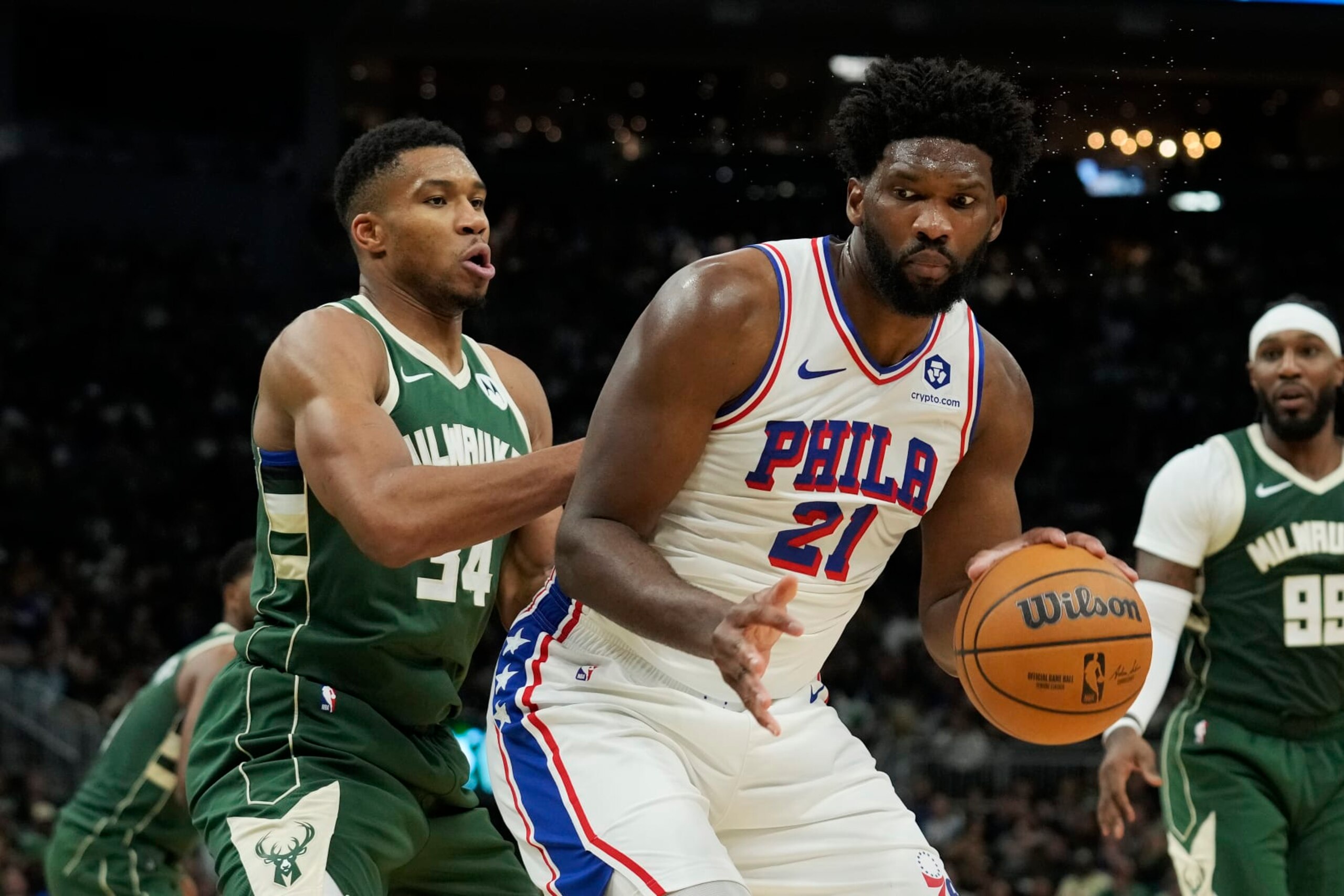 MILWAUKEE, WISCONSIN - OCTOBER 26: Giannis Antetokounmpo #34 of the Milwaukee Bucks defends Joel Embiid #21 of the Philadelphia 76ers in the second half at Fiserv Forum on October 26, 2023 in Milwaukee, Wisconsin. NOTE TO USER: User expressly acknowledges and agrees that, by downloading and or using this photograph, User is consenting to the terms and conditions of the Getty Images License Agreement. (Photo by Patrick McDermott/Getty Images)
