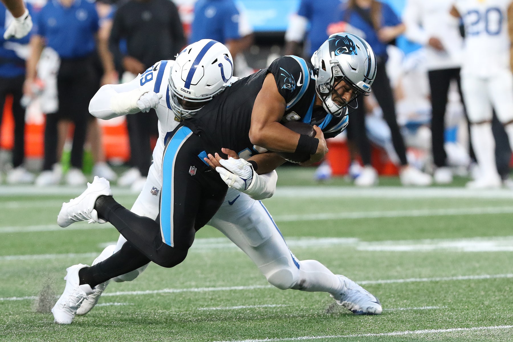 CHARLOTTE, NC - NOVEMBER 05: Carolina Panthers quarterback Bryce Young (9) is tackled by Indianapolis Colts defensive tackle DeForest Buckner (99) after a short gain during a NFL football game between the Indianapolis Colts and the Carolina Panthers on November 5, 2023 at Bank of America Stadium in Charlotte, N.C.(Photo by John Byrum/Icon Sportswire via Getty Images)