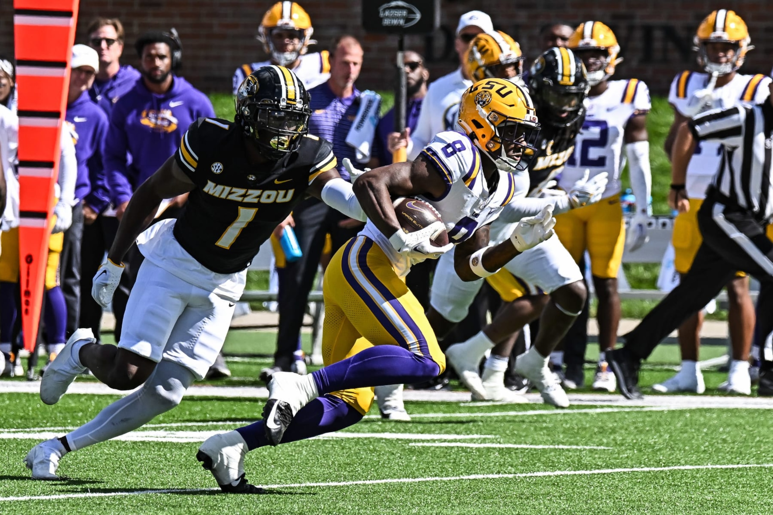 COLUMBIA, MO - OCTOBER 07: LSU Tigers wide receiver Malik Nabers (8) gets away from the tackle attempt fo Missouri Tigers defensive back Jaylon Carlies (1) during a SEC conference game between the Louisiana State Tigers and the Missouri Tigers held on Saturday Oct 07, 2023 at Faurot Field at Memorial Stadium in Columbia MO. (Photo by Rick Ulreich/Icon Sportswire via Getty Images COLUMBIA, MO - OCTOBER 07: LSU Tigers wide receiver Malik Nabers (8) gets away from the tackle attempt fo Missouri Tigers defensive back Jaylon Carlies (1) during a SEC conference game between the Louisiana State Tigers and the Missouri Tigers held on Saturday Oct 07, 2023 at Faurot Field at Memorial Stadium in Columbia MO. (Photo by Rick Ulreich/Icon Sportswire via Getty Images