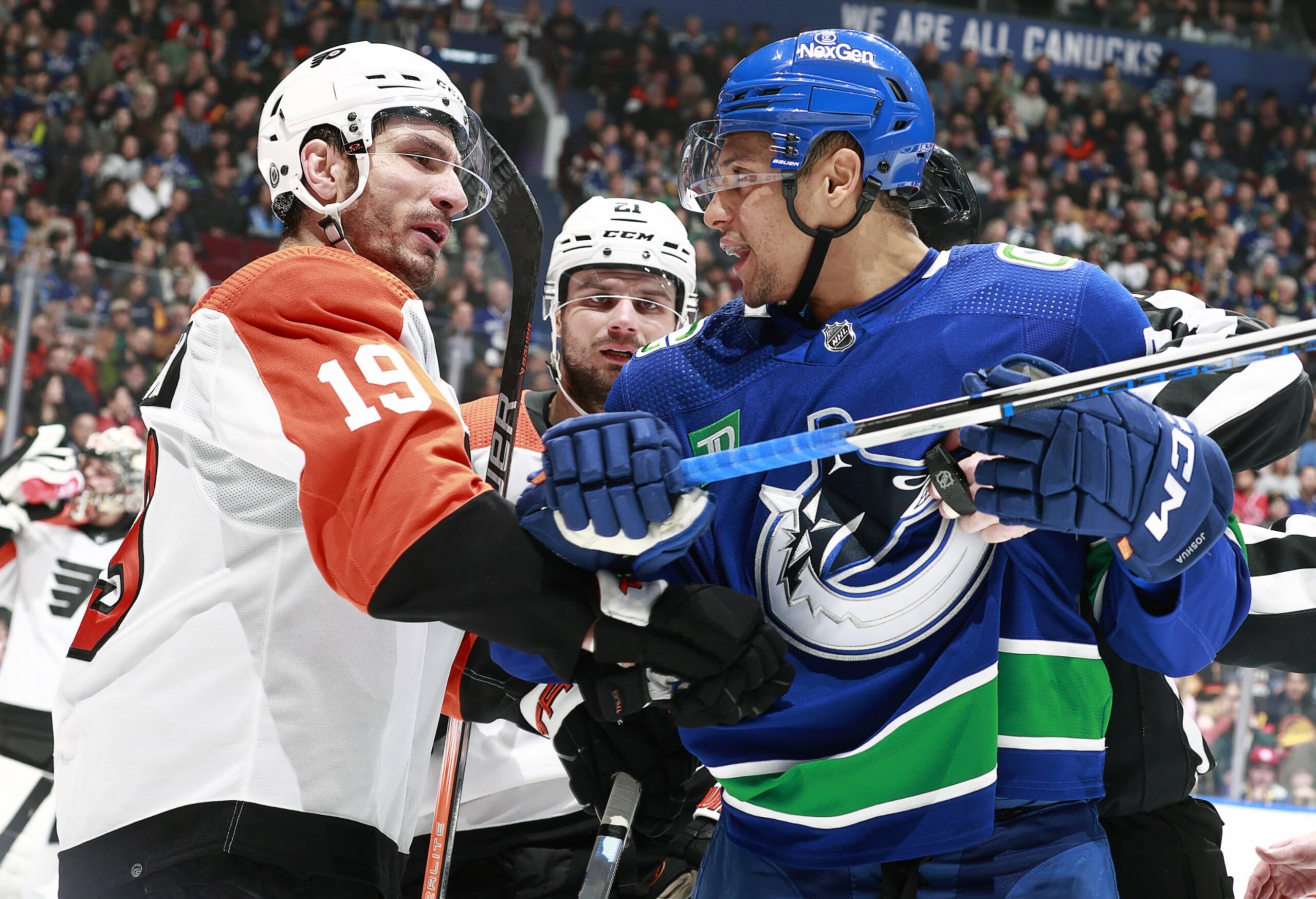 VANCOUVER, CANADA - DECEMBER 28: Dakota Joshua #81 of the Vancouver Canucks and Garnet Hathaway #19 of the Philadelphia Flyers exchange words during their NHL game at Rogers Arena on December 28, 2023 in Vancouver, British Columbia, Canada.  (Photo by Jeff Vinnick/NHLI via Getty Images)