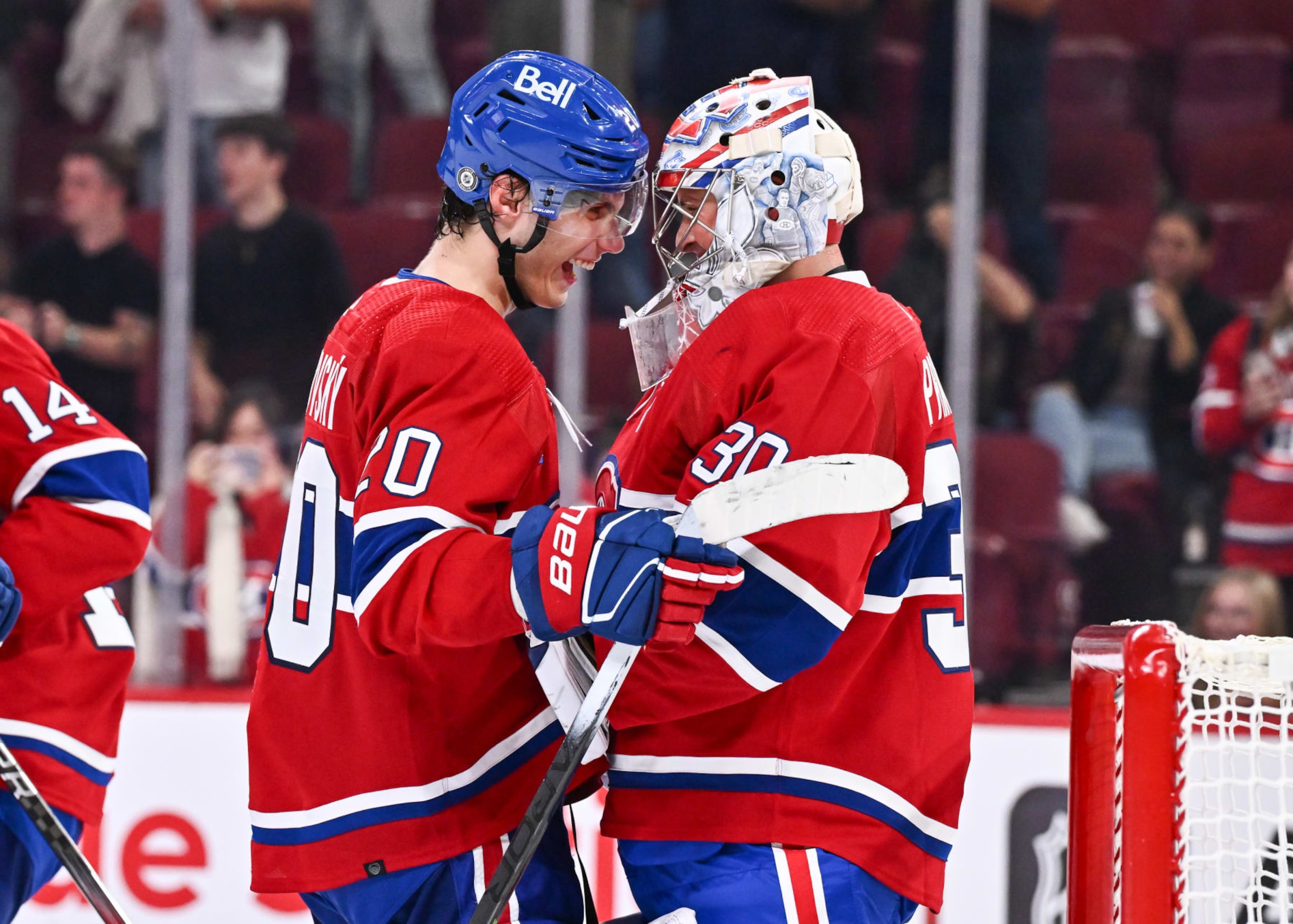 MONTREAL, CANADA - SEPTEMBER 27:  Juraj Slafkovsky #20 and Cayden Primeau #30 of the Montreal Canadiens celebrate a victory against the Ottawa Senators at the Bell Centre on September 27, 2023 in Montreal, Quebec, Canada.  The Montreal Canadiens defeated the Ottawa Senators 4-3.  (Photo by Minas Panagiotakis/Getty Images)