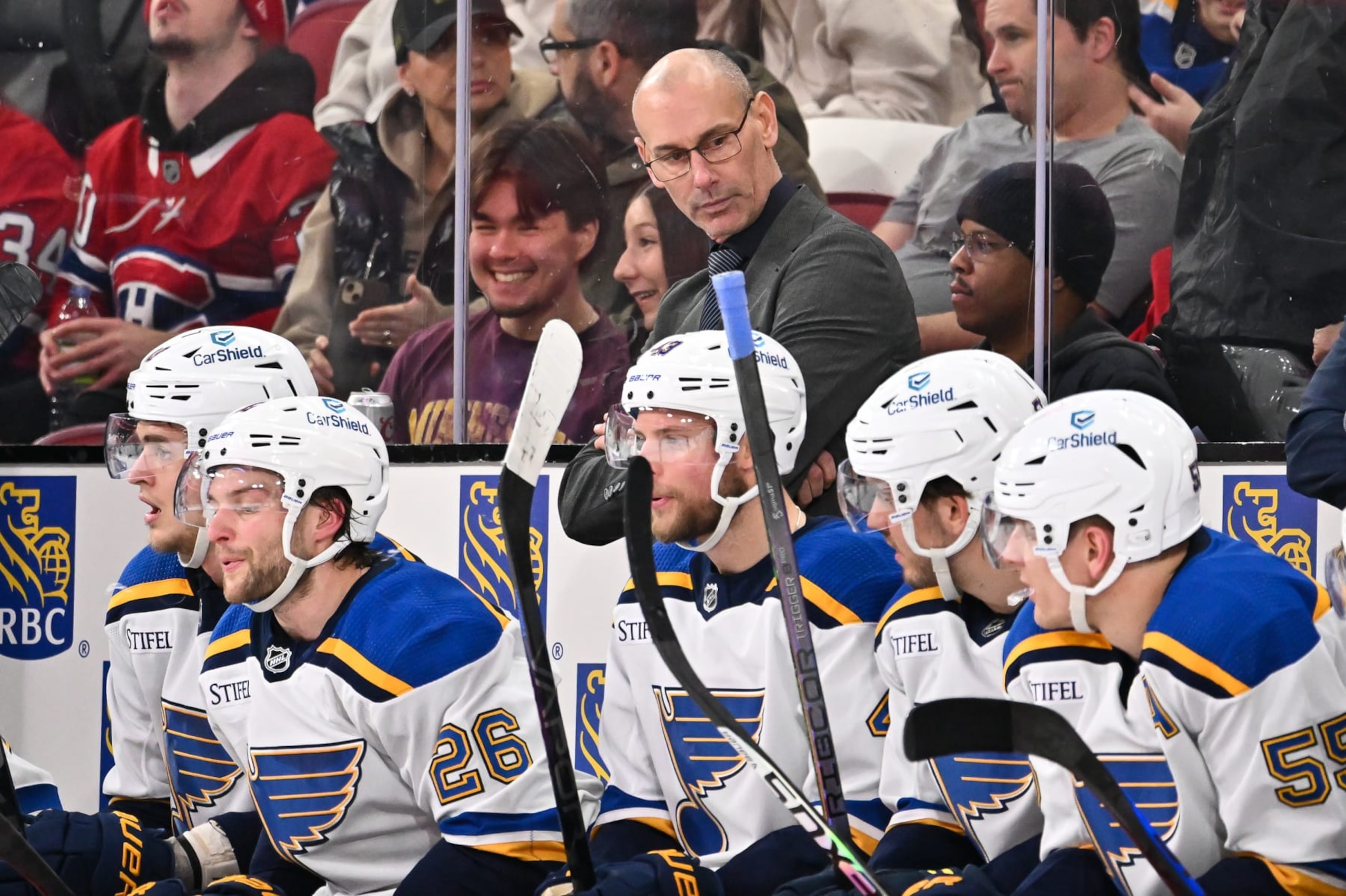MONTREAL, CANADA - FEBRUARY 11:  Interim head coach of the St. Louis Blues Drew Bannister, handles bench duties during the second period against the Montreal Canadiens at the Bell Centre on February 11, 2024 in Montreal, Quebec, Canada.  The St. Louis Blues defeated the Montreal Canadiens 7-2.  (Photo by Minas Panagiotakis/Getty Images)