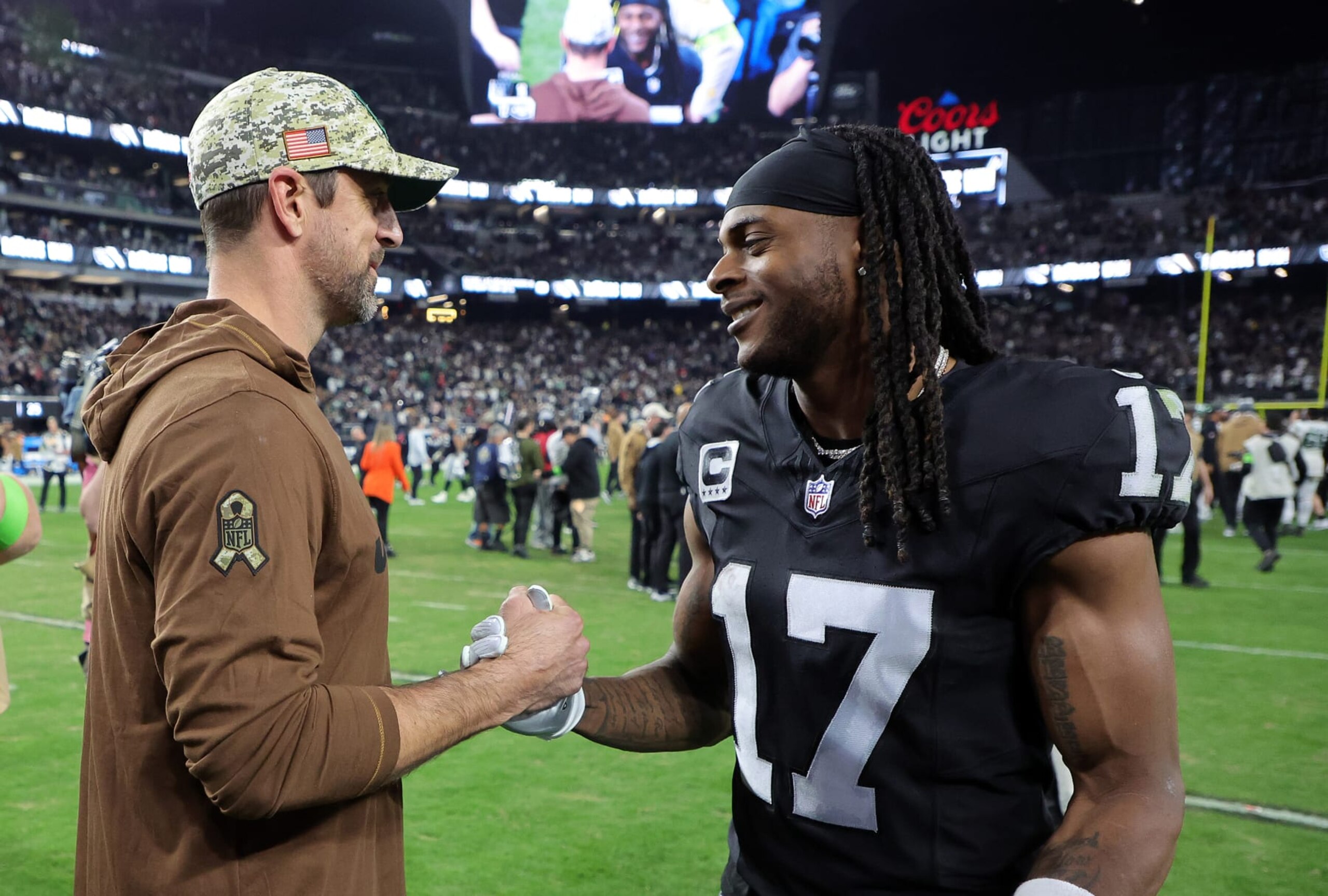 LAS VEGAS, NEVADA - NOVEMBER 12:  Quarterback Aaron Rodgers #8 of the New York Jets talks with wide receiver Davante Adams #17 of the Las Vegas Raiders after the Raiders defeated the Jets to win the game at Allegiant Stadium on November 12, 2023 in Las Vegas, Nevada. (Photo by Ethan Miller/Getty Images)