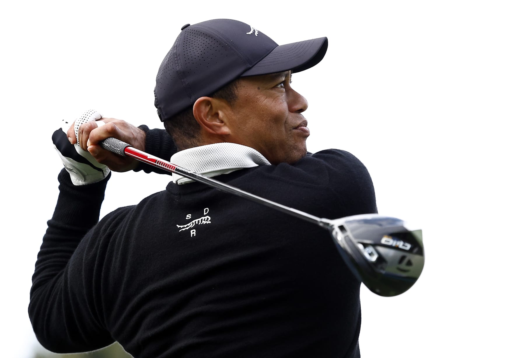 PACIFIC PALISADES, CALIFORNIA - FEBRUARY 14:  Tiger Woods of the United States tees off the ninth hole during a Pro-Am prior to The Genesis Invitational at Riviera Country Club on February 14, 2024 in Pacific Palisades, California. (Photo by Ronald Martinez/Getty Images)