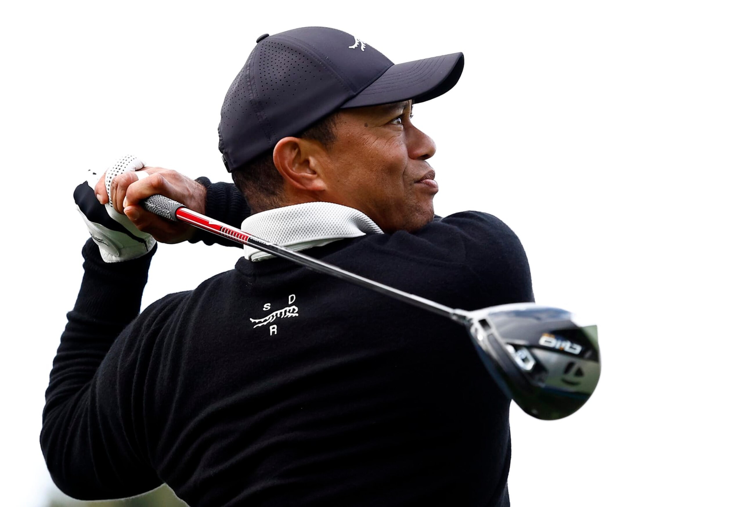 PACIFIC PALISADES, CALIFORNIA - FEBRUARY 14:  Tiger Woods of the United States tees off the ninth hole during a Pro-Am prior to The Genesis Invitational at Riviera Country Club on February 14, 2024 in Pacific Palisades, California. (Photo by Ronald Martinez/Getty Images)