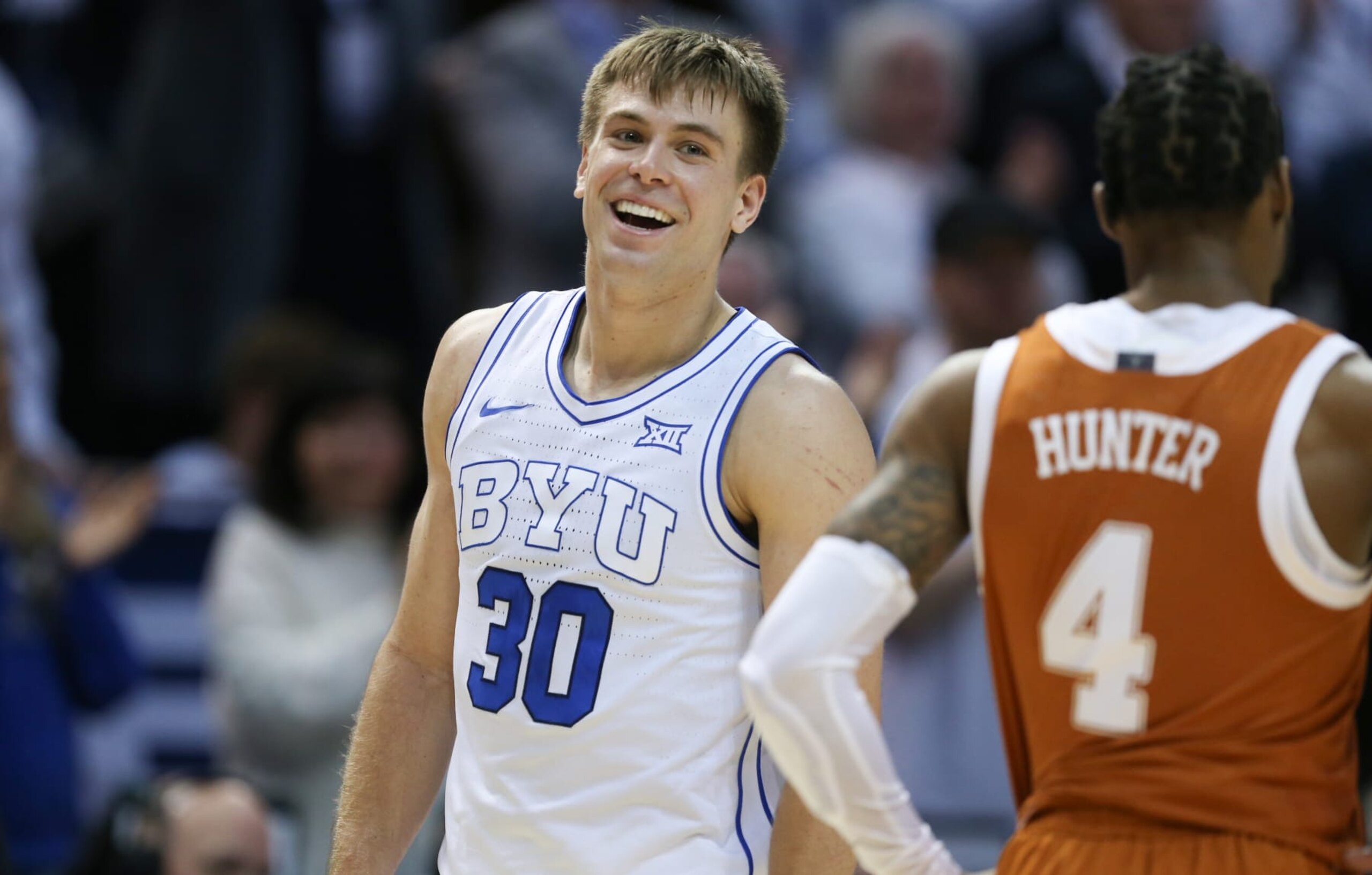 PROVO, UT - JANUARY 27: Dallin Hall #30 of the Brigham Young Cougars smiles as he walks off the court after their win against the Texas Longhorns at the Marriott Center  on January 27, 2024 in Provo, Utah. (Photo by Chris Gardner/Getty Images)