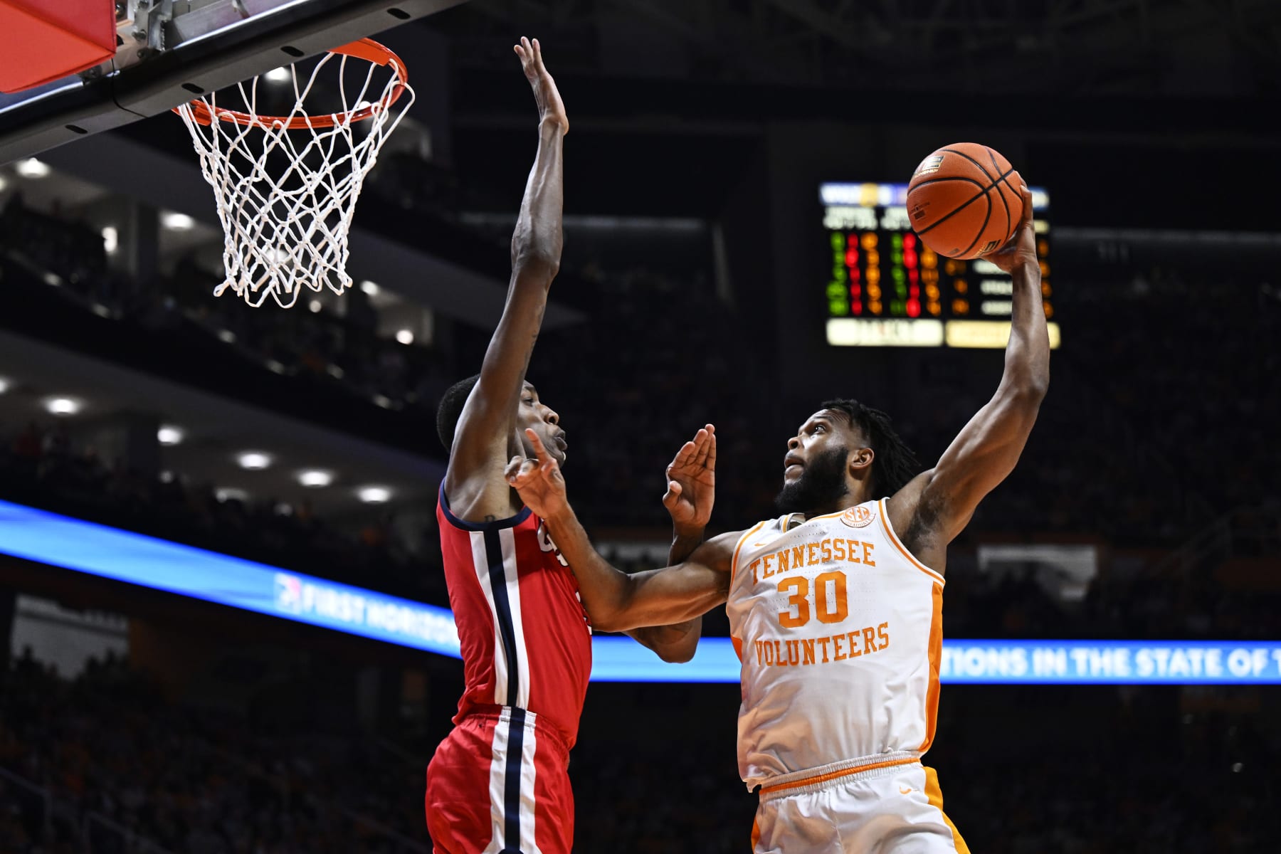 KNOXVILLE, TENNESSEE - JANUARY 06: Josiah-Jordan James #30 of the Tennessee Volunteers goes up for two against Jamarion Sharp #3 of the Ole Miss Rebels in the second half at Thompson-Boling Arena on January 06, 2024 in Knoxville, Tennessee. (Photo by Eakin Howard/Getty Images)