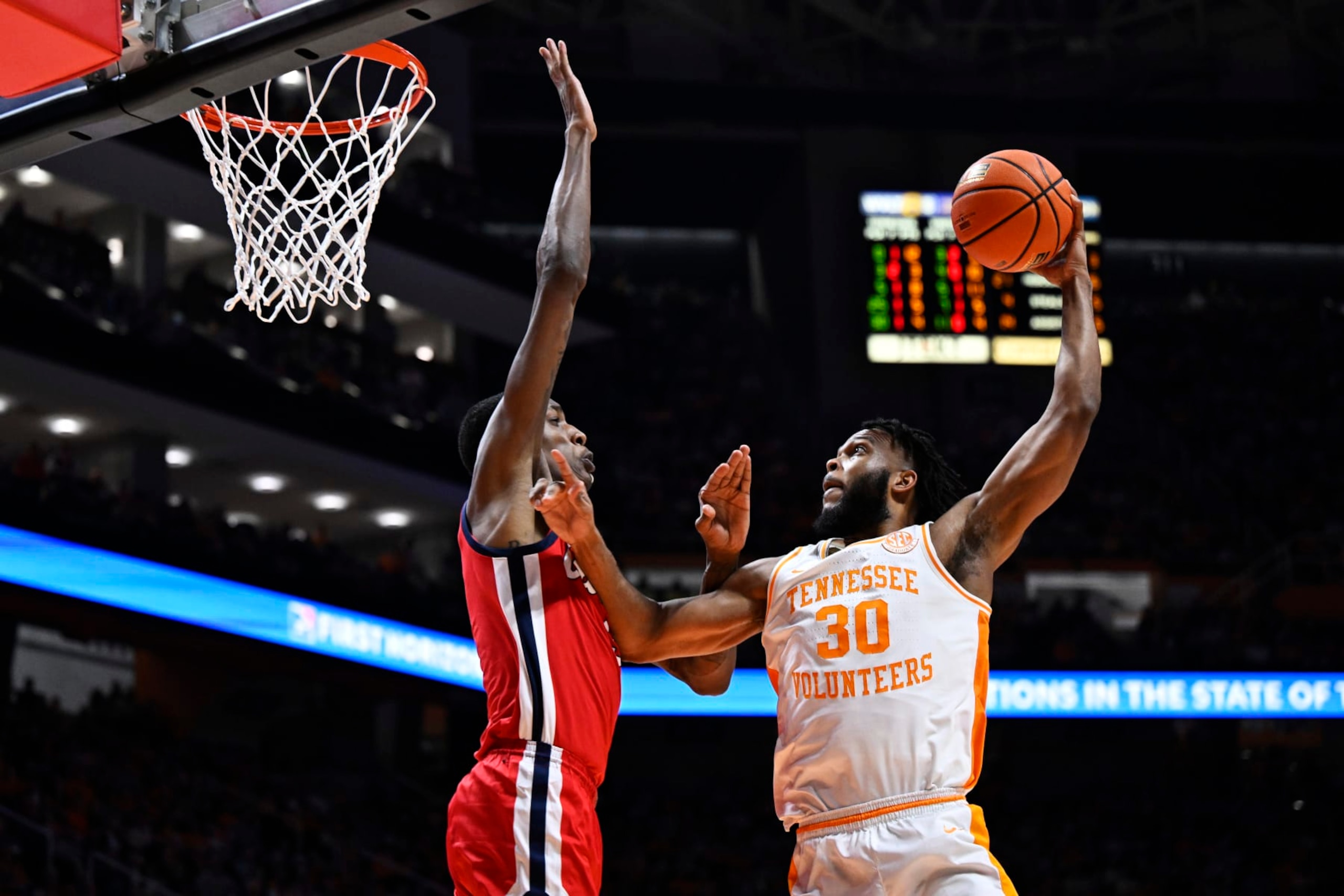 KNOXVILLE, TENNESSEE - JANUARY 06: Josiah-Jordan James #30 of the Tennessee Volunteers goes up for two against Jamarion Sharp #3 of the Ole Miss Rebels in the second half at Thompson-Boling Arena on January 06, 2024 in Knoxville, Tennessee. (Photo by Eakin Howard/Getty Images) KNOXVILLE, TENNESSEE - JANUARY 06: Josiah-Jordan James #30 of the Tennessee Volunteers goes up for two against Jamarion Sharp #3 of the Ole Miss Rebels in the second half at Thompson-Boling Arena on January 06, 2024 in Knoxville, Tennessee. (Photo by Eakin Howard/Getty Images)