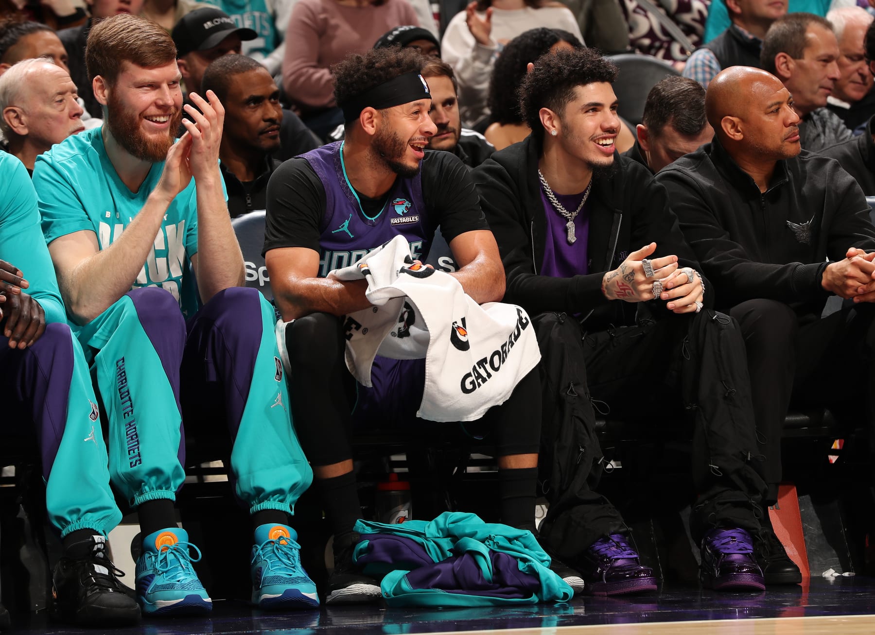 CHARLOTTE, NC - February 12: Davis Bertans #9, Seth Curry #30, and LaMelo Ball #1 of the Charlotte Hornets look on during the game against the Indiana Pacers on February 12, 2024 at Spectrum Center in Charlotte, North Carolina. NOTE TO USER: User expressly acknowledges and agrees that, by downloading and or using this photograph, User is consenting to the terms and conditions of the Getty Images License Agreement. Mandatory Copyright Notice: Copyright 2024 NBAE (Photo by Kent Smith/NBAE via Getty Images)
