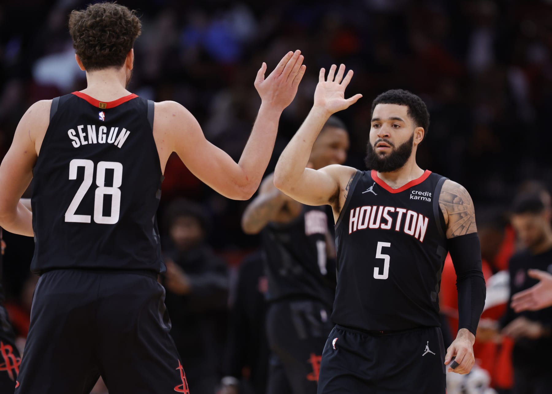 HOUSTON, TEXAS - JANUARY 03: Fred VanVleet #5 of the Houston Rockets high fives Alperen Sengun #28  against the Brooklyn Nets during the second half at Toyota Center on January 03, 2024 in Houston, Texas. NOTE TO USER: User expressly acknowledges and agrees that, by downloading and or using this photograph, User is consenting to the terms and conditions of the Getty Images License Agreement.  (Photo by Carmen Mandato/Getty Images)