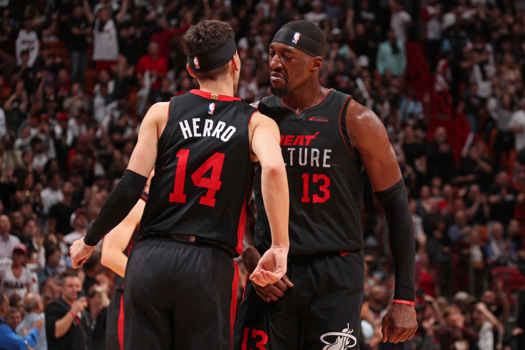 MIAMI, FL - JANUARY 19: Bam Adebayo #13 and Tyler Herro #14 of the Miami Heat celebrate during the game against the Atlanta Hawks on January 19, 2024 at Kaseya Center in Miami, Florida. NOTE TO USER: User expressly acknowledges and agrees that, by downloading and or using this Photograph, user is consenting to the terms and conditions of the Getty Images License Agreement. Mandatory Copyright Notice: Copyright 2024 NBAE (Photo by Issac Baldizon/NBAE via Getty Images)