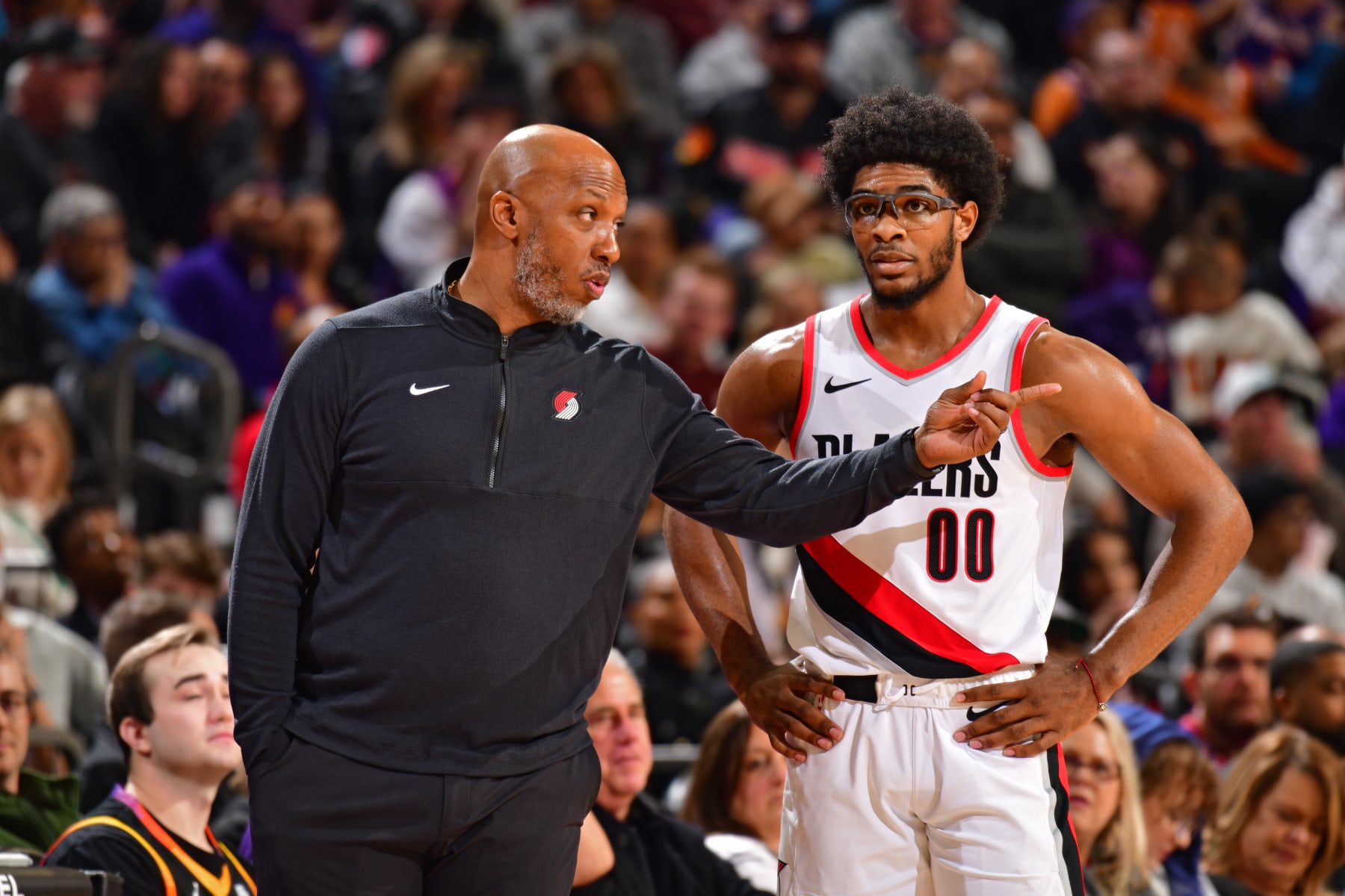 PHOENIX, AZ - JANUARY 1:  Head Coach Chauncey Billups of the Portland Trail Blazers talks to Scoot Henderson #00 during the game against the Phoenix Suns on January 1, 2024 at Footprint Center in Phoenix, Arizona. NOTE TO USER: User expressly acknowledges and agrees that, by downloading and or using this photograph, user is consenting to the terms and conditions of the Getty Images License Agreement. Mandatory Copyright Notice: Copyright 2023 NBAE (Photo by Barry Gossage/NBAE via Getty Images)