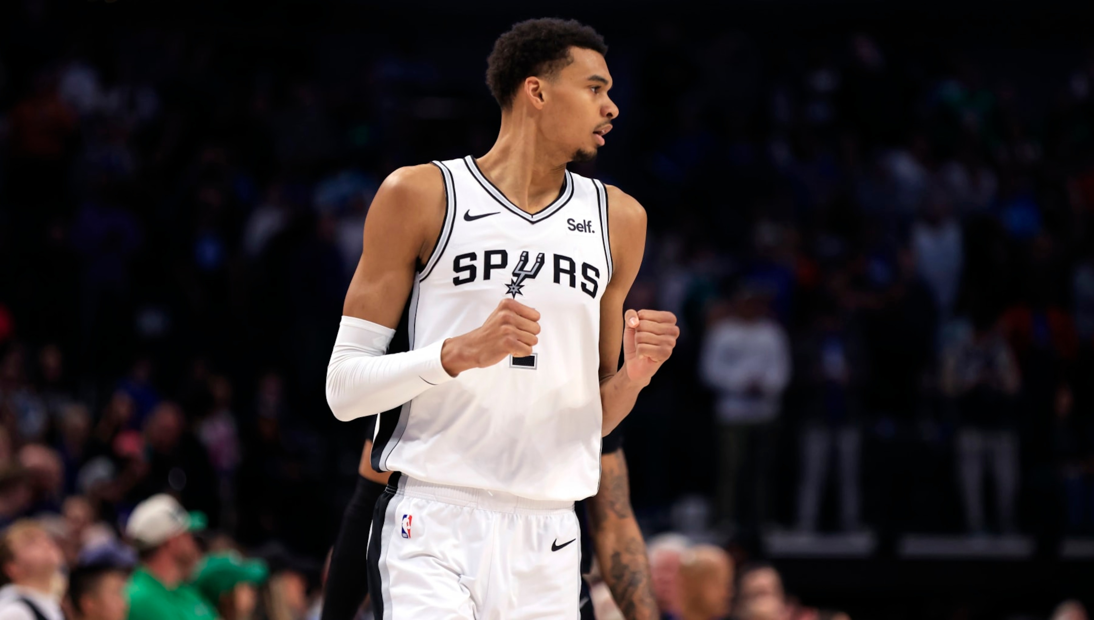 DALLAS, TX - FEBRUARY 14: Victor Wembanyama #1 of the San Antonio Spurs reacts after scoring a three point basket against the Dallas Mavericks in the first half at American Airlines Center on February 14, 2024 in Dallas, Texas. NOTE TO USER: User expressly acknowledges and agrees that, by downloading and or using this photograph, User is consenting to the terms and conditions of the Getty Images License Agreement. (Photo by Ron Jenkins/Getty Images)