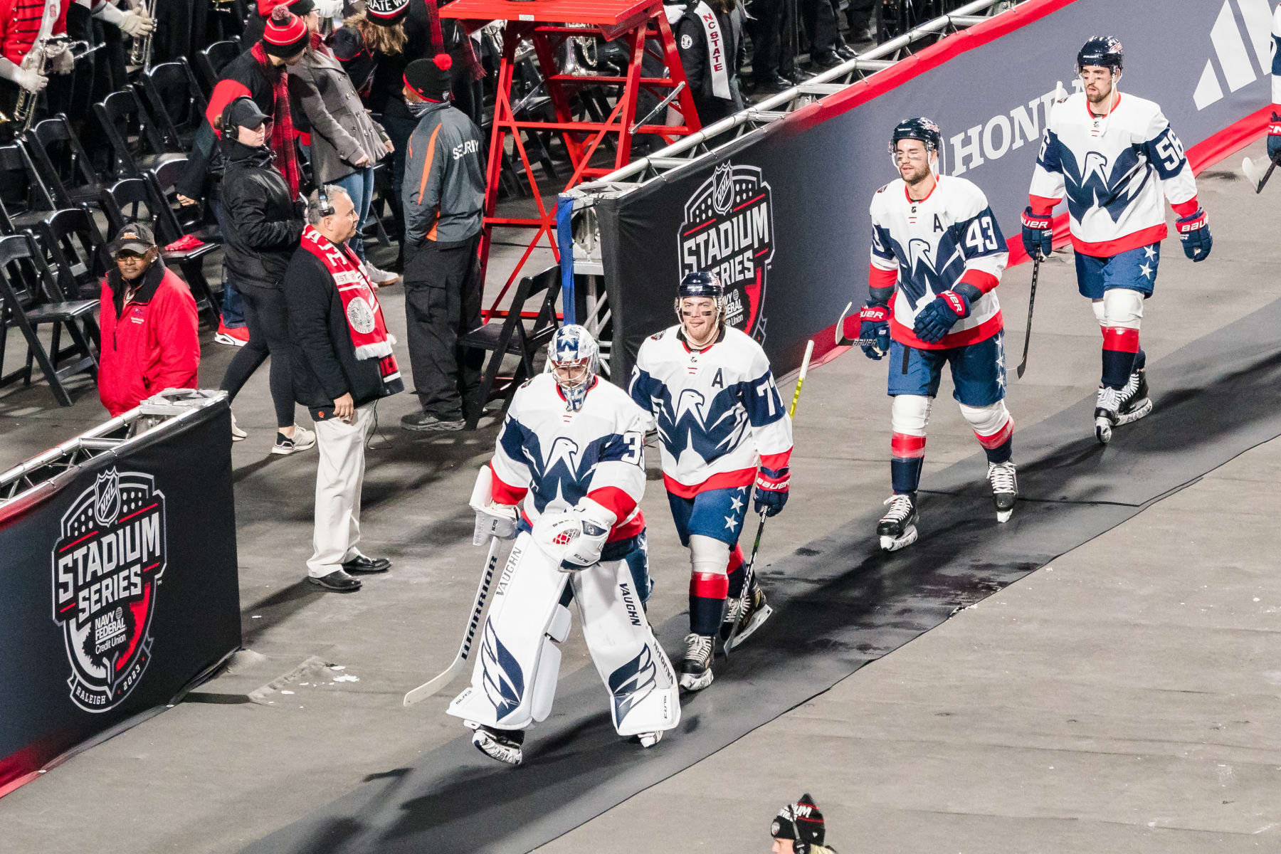 RALEIGH, NORTH CAROLINA - FEBRUARY 18: The Washington Capitals walk to the rink before their game against the Carolina Hurricanes at Carter-Finley Stadium on February 18, 2023 in Raleigh, North Carolina. (Photo by Jacob Kupferman/Getty Images)