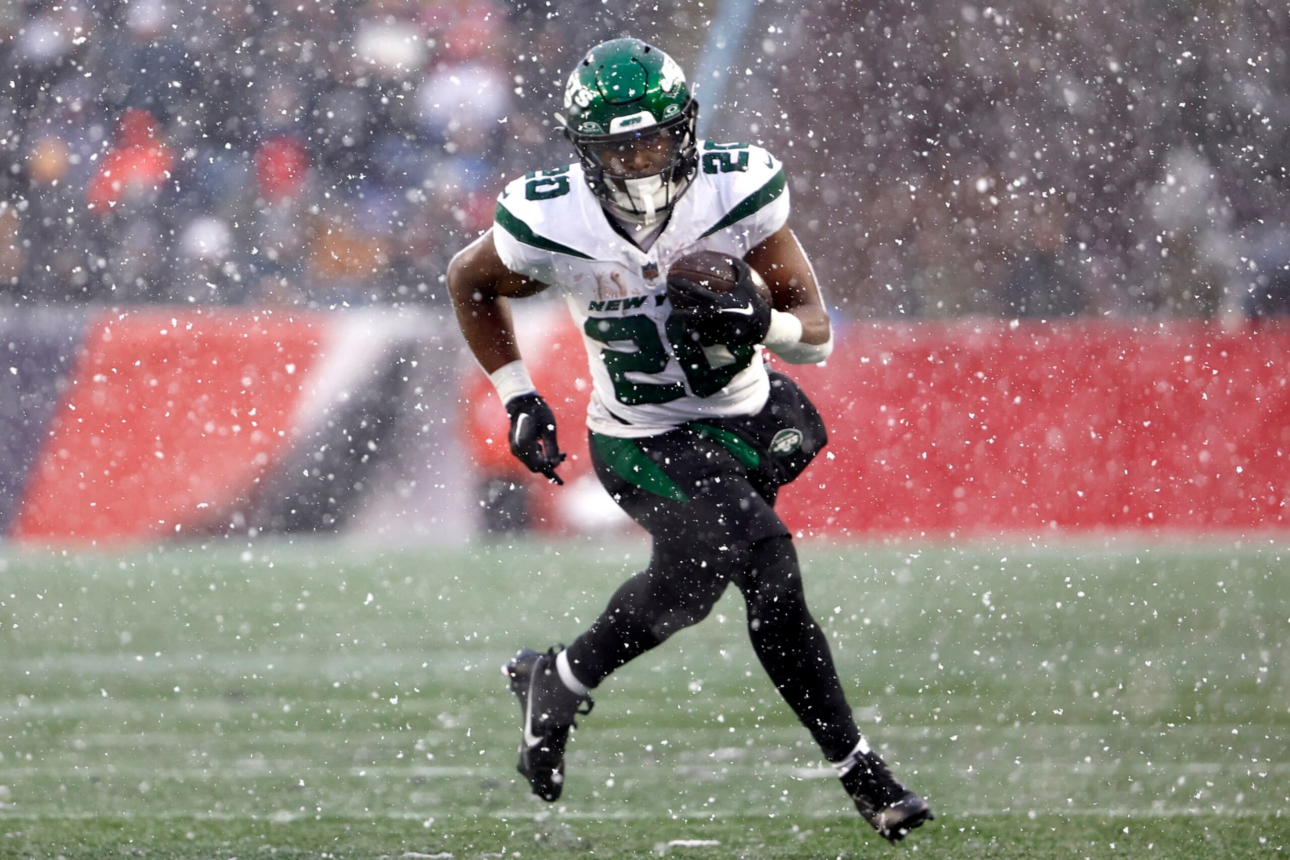 FOXBOROUGH, MASSACHUSETTS - JANUARY 07: Breece Hall #20 of the New York Jets runs the ball in the first half at Gillette Stadium on January 07, 2024 in Foxborough, Massachusetts. (Photo by Winslow Townson/Getty Images)