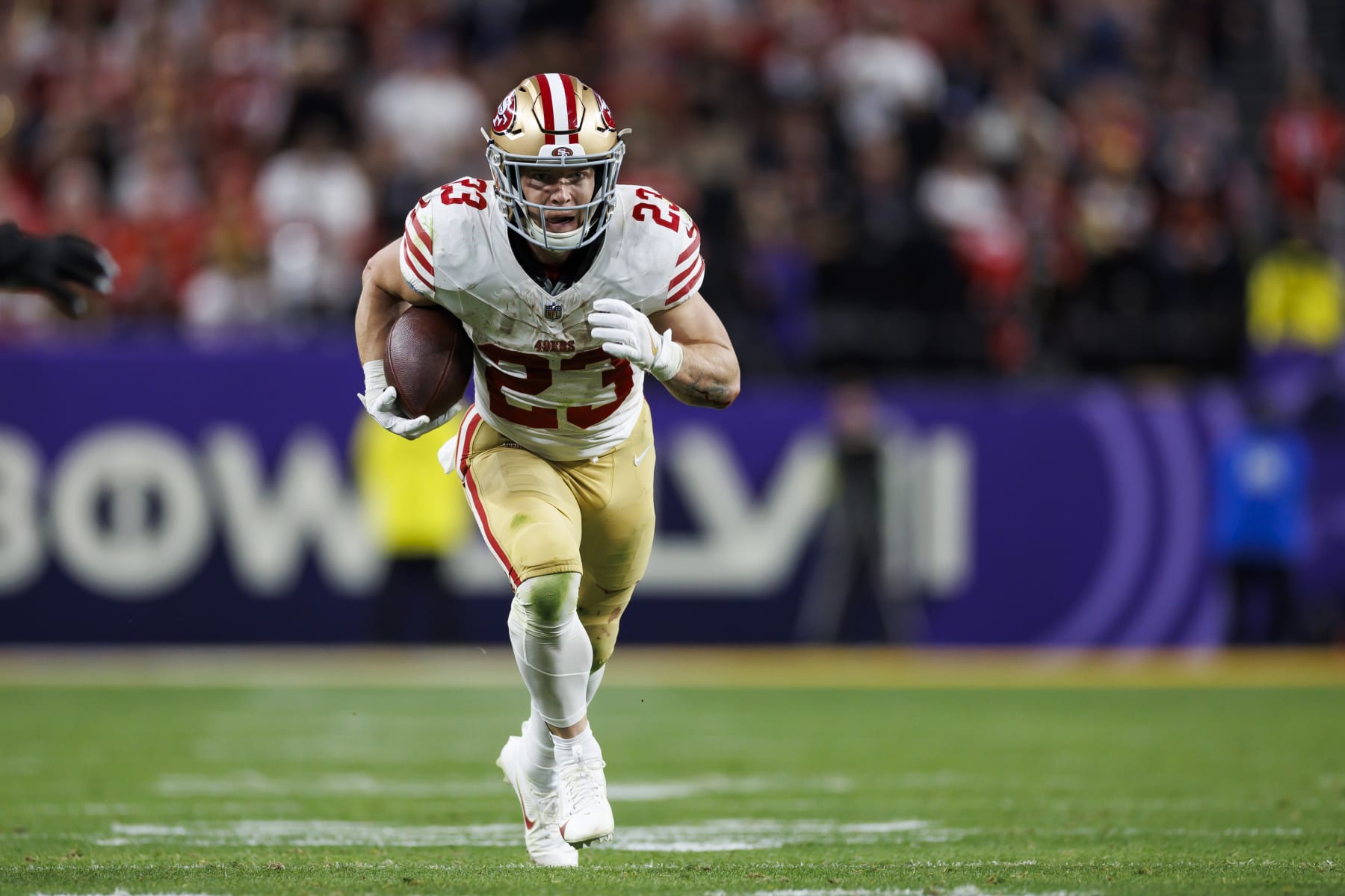 LAS VEGAS, NEVADA - FEBRUARY 11: Christian McCaffrey #23 of the San Francisco 49ers runs the ball to score a touchdown during Super Bowl LVIII against the Kansas City Chiefs at Allegiant Stadium on February 11, 2024 in Las Vegas, Nevada. (Photo by Ryan Kang/Getty Images)